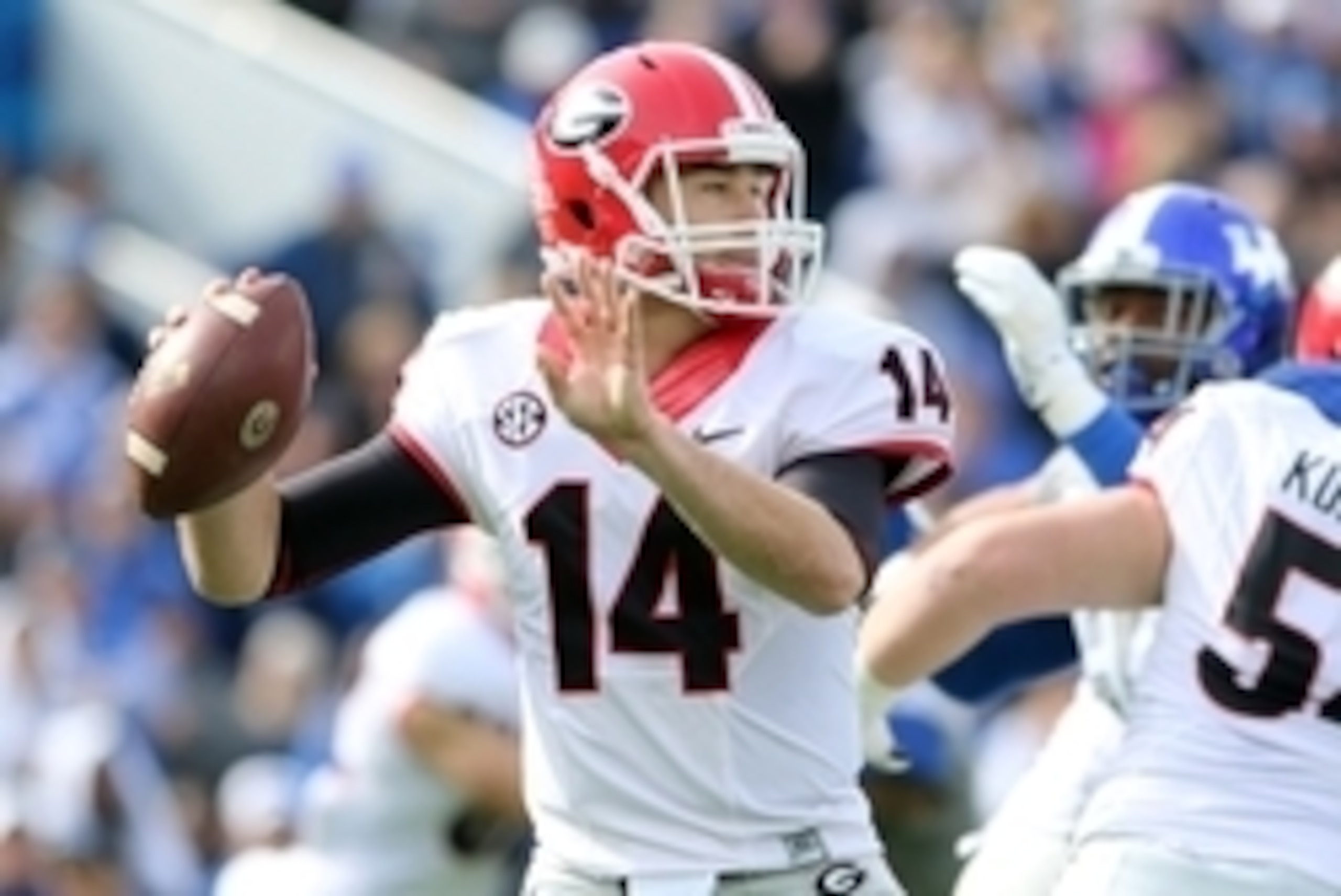 Nov 8, 2014; Lexington, KY, USA; Georgia Bulldogs quarterback Hutson Mason (14) throws a pass against the Kentucky Wildcats in the first half at Commonwealth Stadium. Mandatory Credit: Mark Zerof-USA TODAY Sports