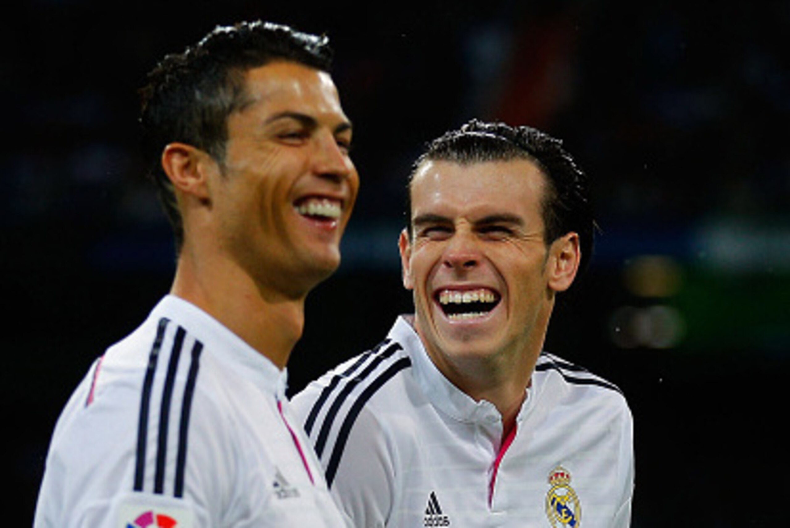 MADRID, SPAIN - NOVEMBER 08: Cristiano Ronaldo (L) of Real Madrid CF joke swith his teammate Gareth Bale prior to start the La Liga match between Real Madrid CF and Rayo Vallecano de Madrid at Estadio Santiago Bernabeu on November 8, 2014 in Madrid, Spain
