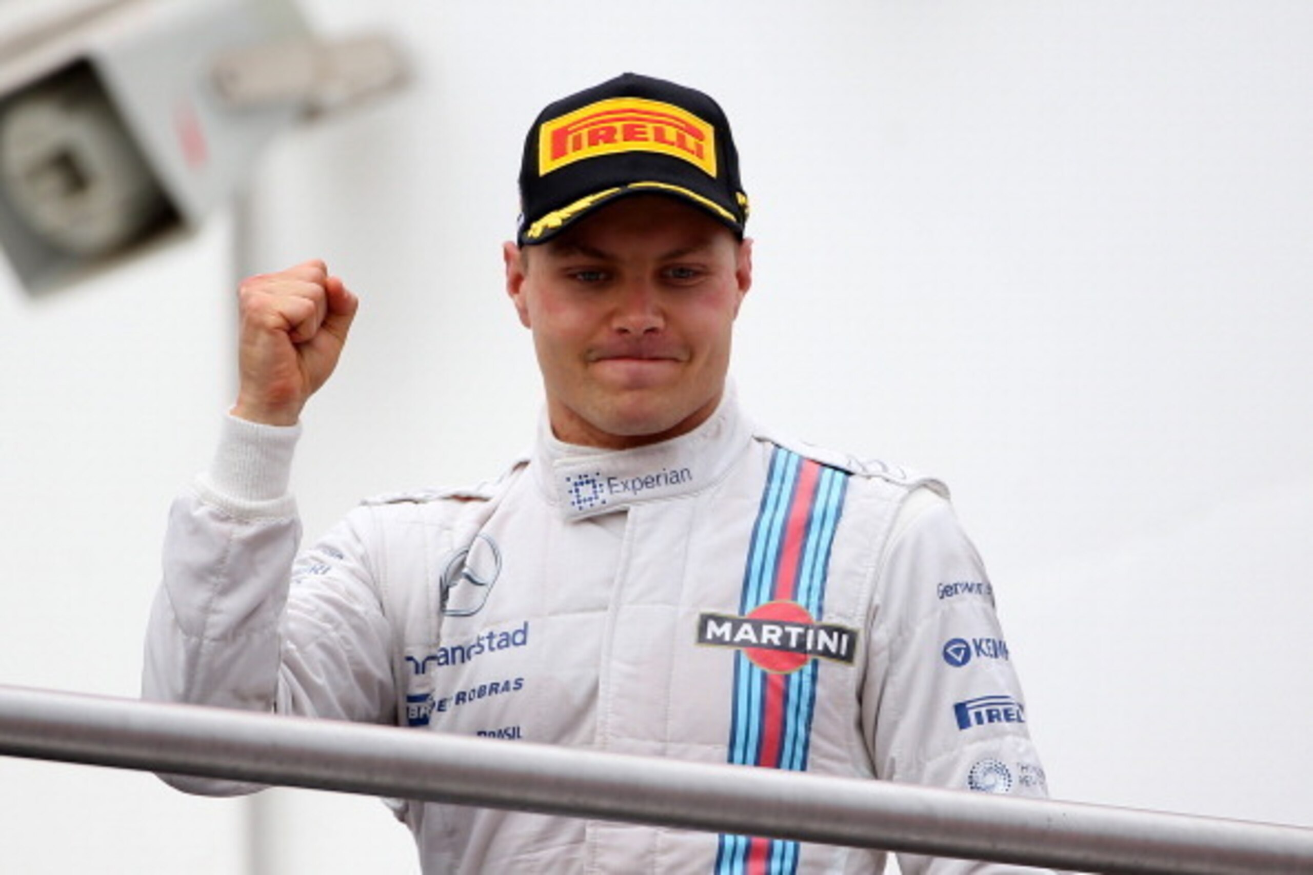 HOCKENHEIM, GERMANY - JULY 20:  Valtteri Bottas of Finland and Williams celebrates on the podium after claiming second place in the German Grand Prix at Hockenheimring on July 20, 2014 in Hockenheim, Germany.  (Photo by Mark Thompson/Getty Images)