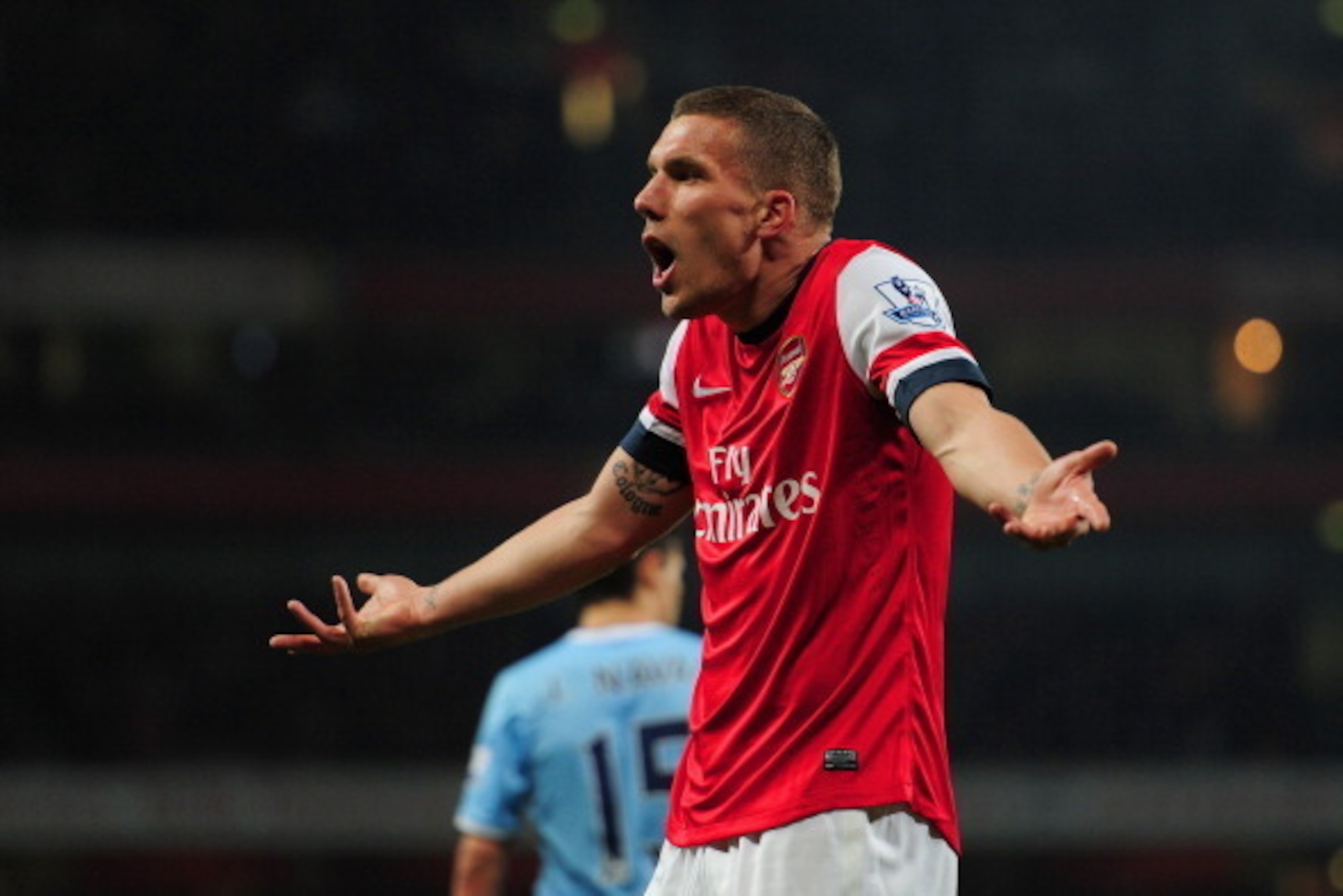 LONDON, ENGLAND - MARCH 29: Lukas Podolski of Arsenal reacts during the Barclays Premier League match between Arsenal and Manchester City at Emirates Stadium on March 29, 2014 in London, England. (Photo by Shaun Botterill/Getty Images) LONDON, ENGLAND - MARCH 29: Lukas Podolski of Arsenal reacts during the Barclays Premier League match between Arsenal and Manchester City at Emirates Stadium on March 29, 2014 in London, England. (Photo by Shaun Botterill/Getty Images)