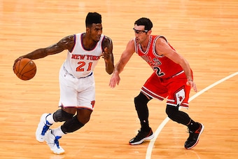 NEW YORK, NY - OCTOBER 29: Iman Shumpert #21 of the New York Knicks attempts to drive past Kirk Hinrich #12 of the Chicago Bulls during a game at Madison Square Garden on October 29, 2014 in New York City. NOTE TO USER: User expressly acknowledges and agr