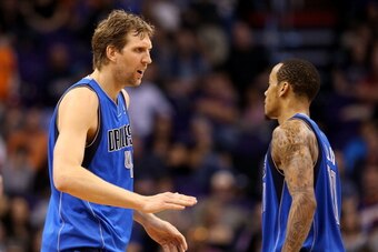 PHOENIX, AZ - JANUARY 17:  Dirk Nowitzki #41 of the Dallas Mavericks high fives Monta Ellis #11 after scoring against the Phoenix Suns during the second half of the NBA game at US Airways Center on January 17, 2014 in Phoenix, Arizona.  The Mavericks defe