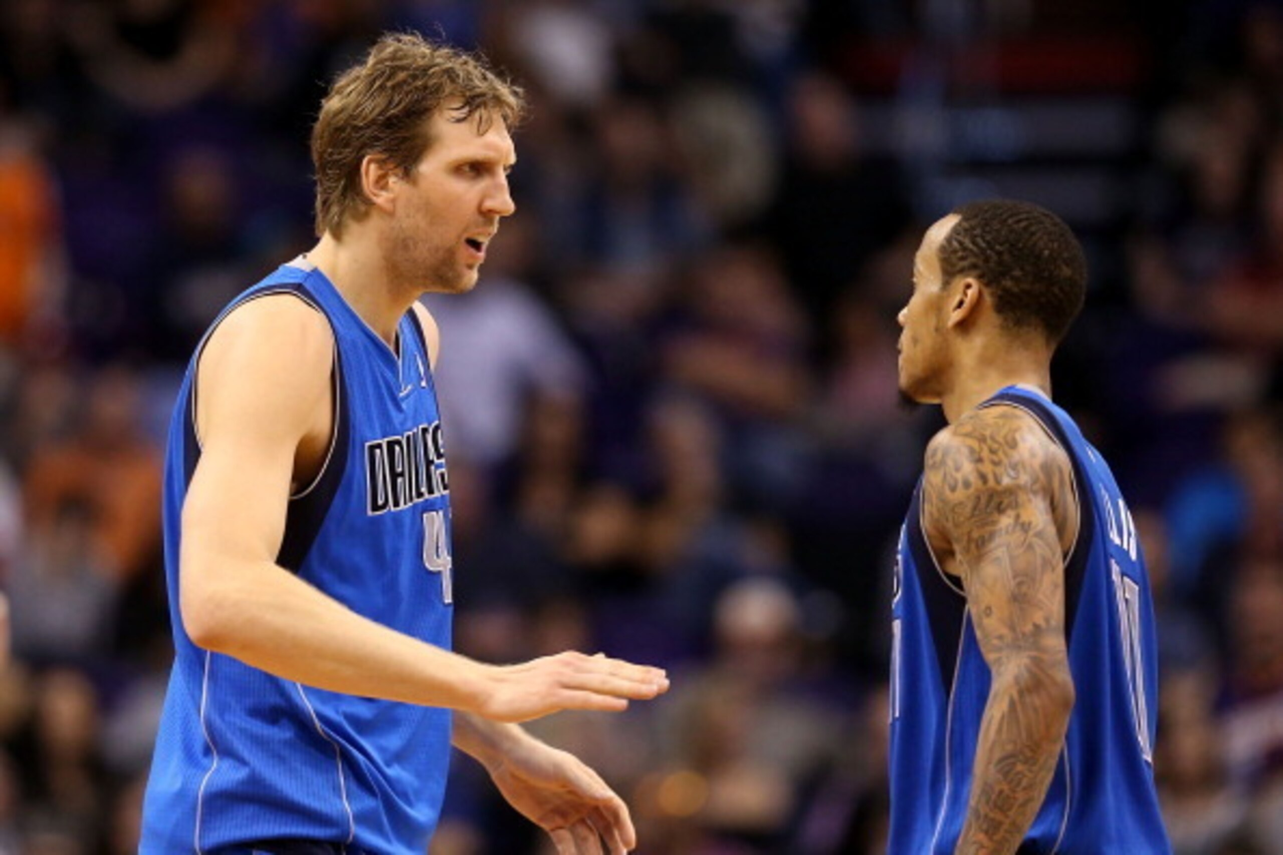 PHOENIX, AZ - JANUARY 17:  Dirk Nowitzki #41 of the Dallas Mavericks high fives Monta Ellis #11 after scoring against the Phoenix Suns during the second half of the NBA game at US Airways Center on January 17, 2014 in Phoenix, Arizona.  The Mavericks defe