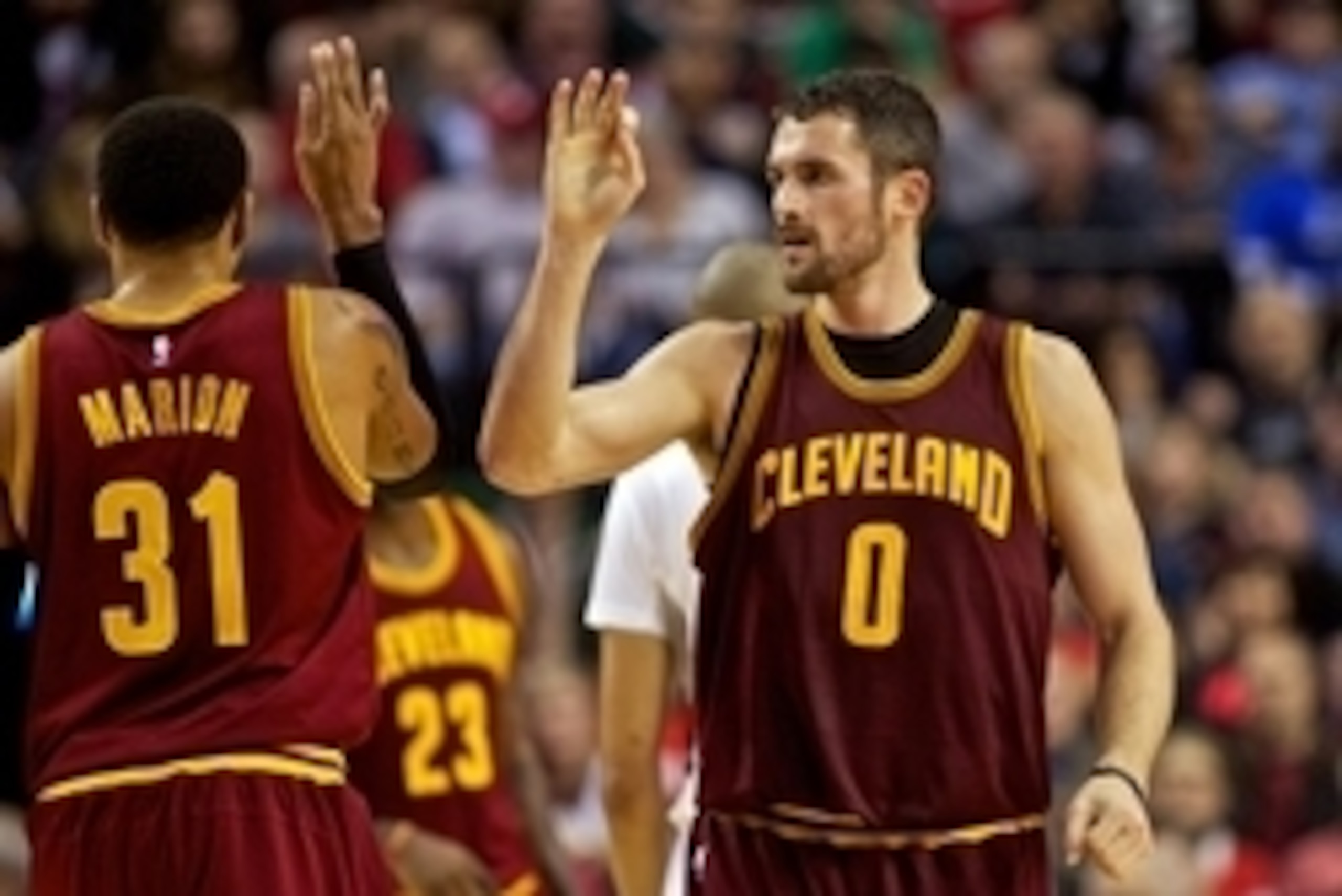 Nov 4, 2014; Portland, OR, USA; Cleveland Cavaliers forward Kevin Love (0) and forward Shawn Marion (31) high five during the second quarter against the Portland Trail Blazers at the Moda Center. Mandatory Credit: Craig Mitchelldyer-USA TODAY Sports