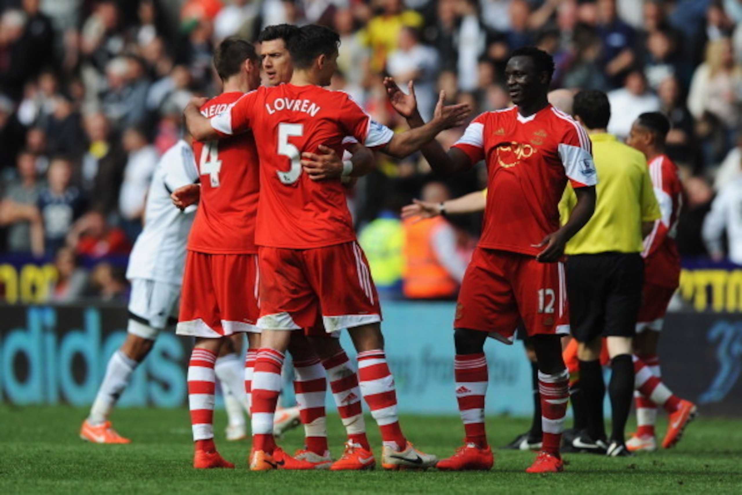 SWANSEA, WALES - MAY 03:  (L-R) Morgan Schneiderlin, Jose Fonte, Dejan Lovren and Victor Wanyama of Southampton celebrate victory after during the Barclays Premier League match between Swansea City and Southampton at Liberty Stadium on May 3, 2014 in Swan