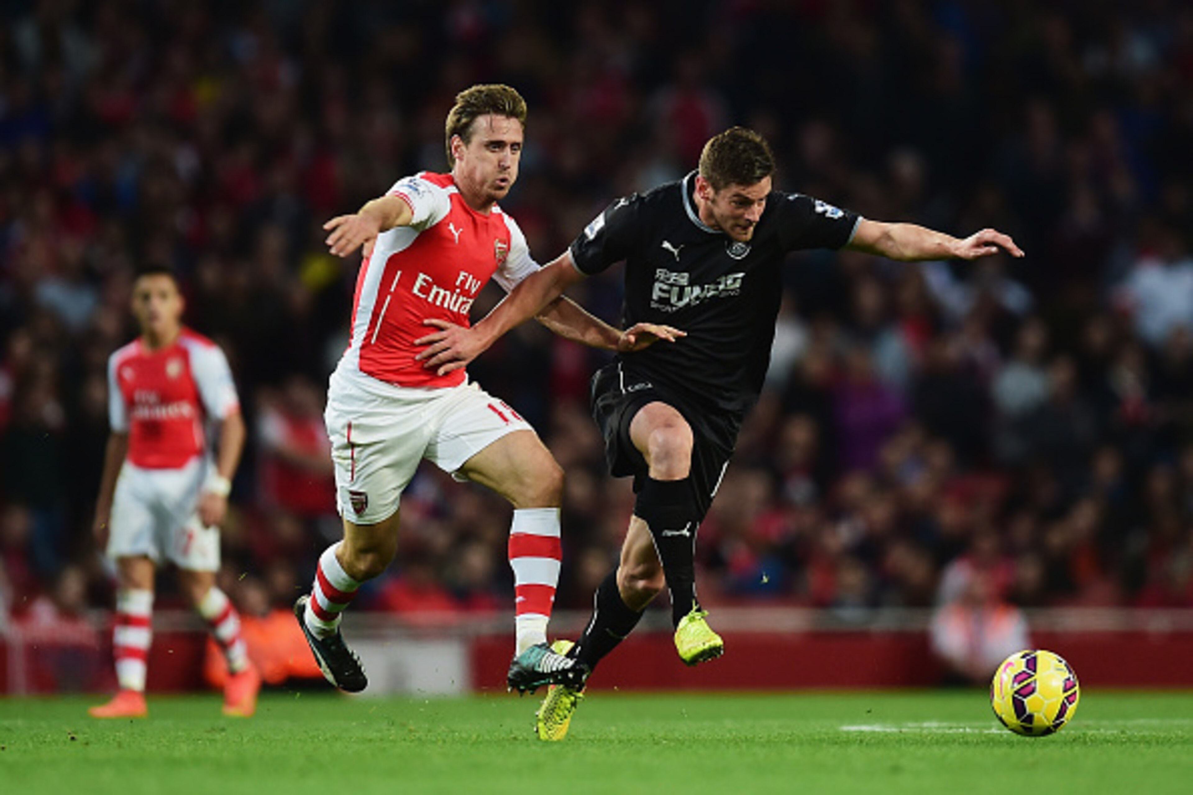 LONDON, ENGLAND - NOVEMBER 01: Nacho Monreal of Arsenal and Thomas Heaton (R) of Burnley in action  during the Barclays Premier League match between Arsenal and Burnley at Emirates Stadium on November 1, 2014 in London, England.  (Photo by Jamie McDonald/