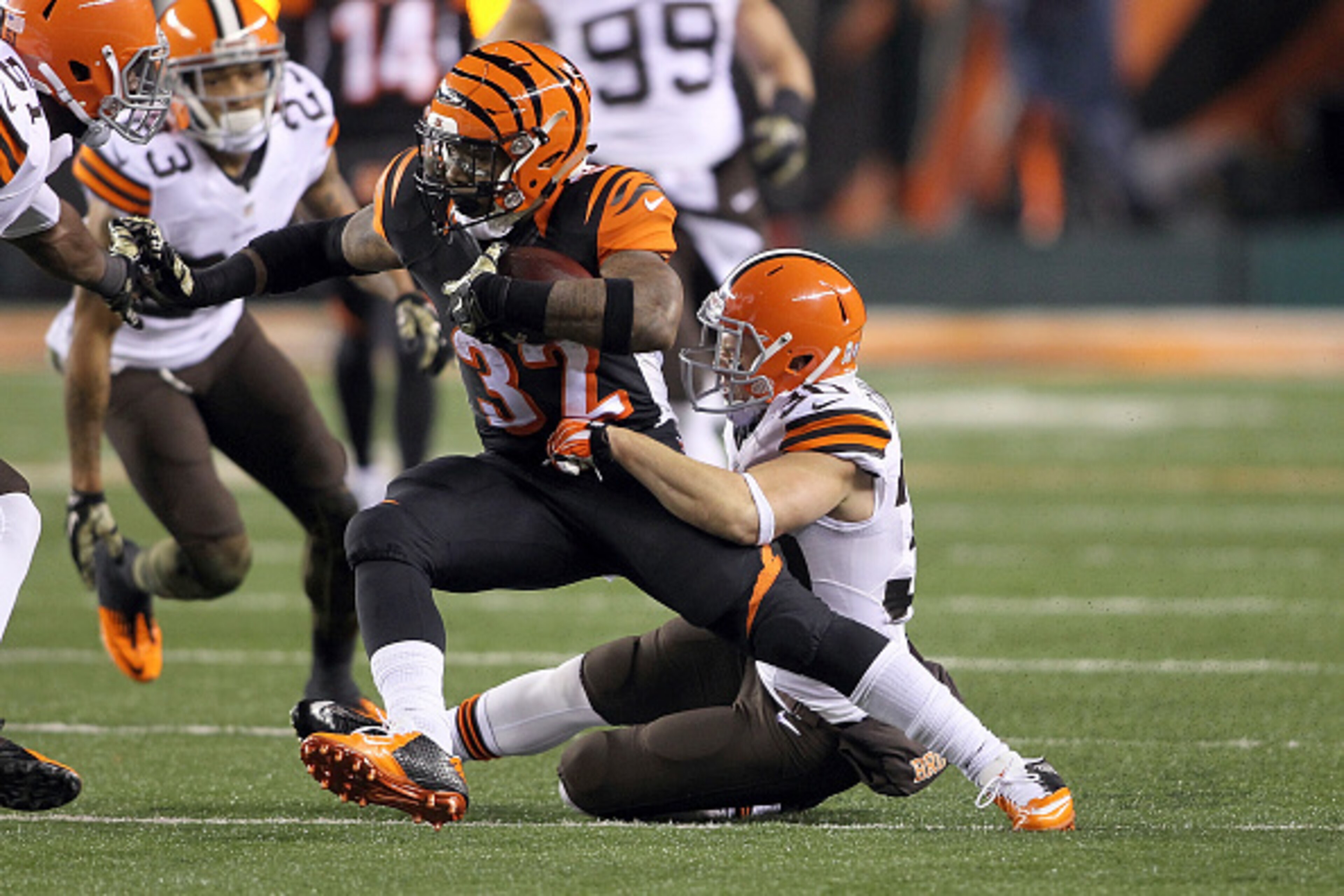 CINCINNATI, OH - NOVEMBER 6: Jeremy Hill #32 of the Cincinnati Bengals is tackled by Jim Leonhard #30 of the Cleveland Browns dying the fourth quarter at Paul Brown Stadium on November 6, 2014 in Cincinnati, Ohio. Cleveland defeated Cincinnati 24-3. (Pho CINCINNATI, OH - NOVEMBER 6: Jeremy Hill #32 of the Cincinnati Bengals is tackled by Jim Leonhard #30 of the Cleveland Browns dying the fourth quarter at Paul Brown Stadium on November 6, 2014 in Cincinnati, Ohio. Cleveland defeated Cincinnati 24-3. (Pho