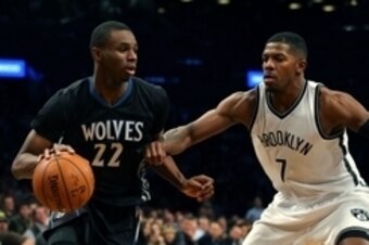Nov 5, 2014; Brooklyn, NY, USA; Minnesota Timberwolves guard Andrew Wiggins (22) drives to the basket past Brooklyn Nets guard Joe Johnson (7) during the fourth quarter at the Barclays Center. The Timberwolves defeated the Nets 98-91. Mandatory Credit: Ad