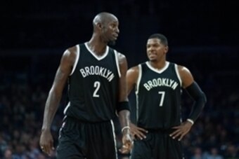 Nov 1, 2014; Auburn Hills, MI, USA; Brooklyn Nets center Kevin Garnett (2) and guard Joe Johnson (7) during the third quarter against the Detroit Pistons at The Palace of Auburn Hills. Mandatory Credit: Tim Fuller-USA TODAY Sports
