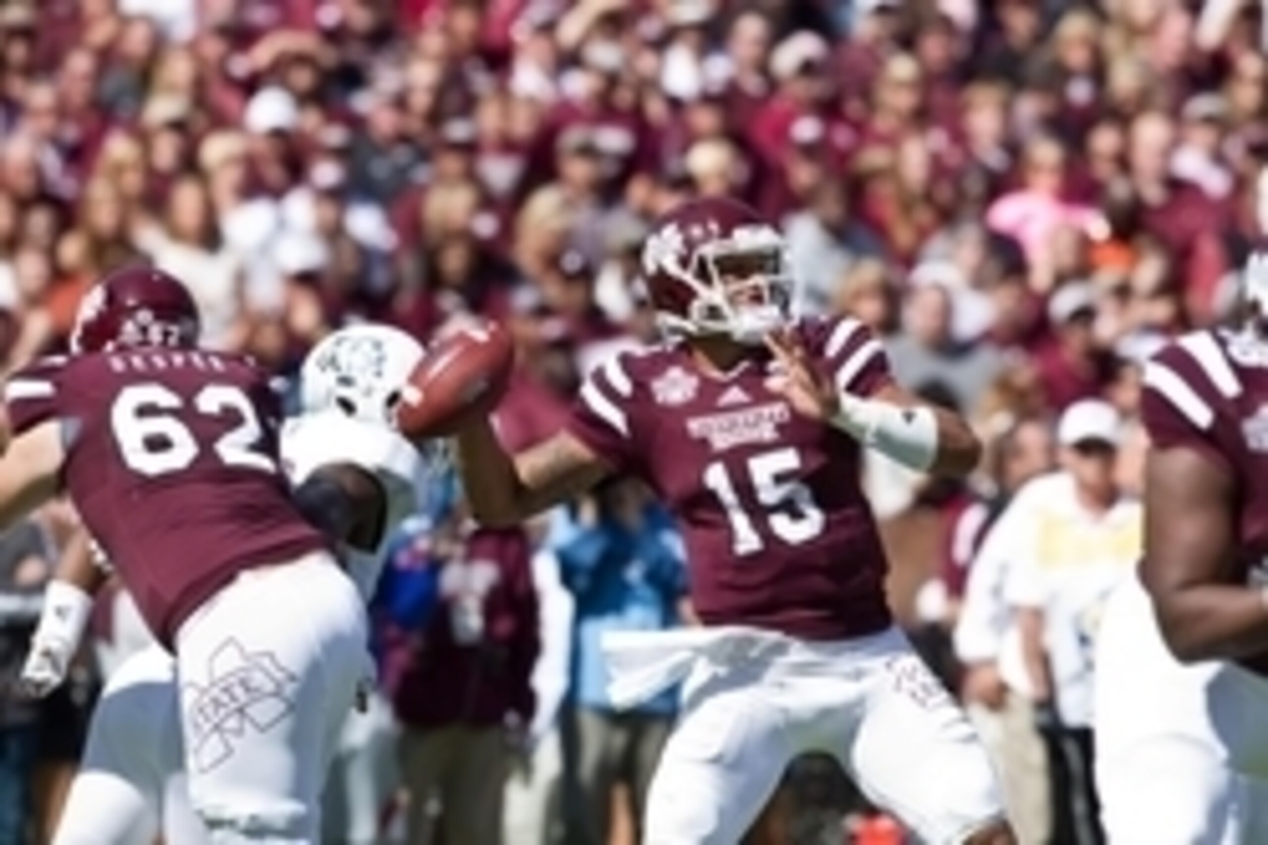 Oct 4, 2014; Starkville, MS, USA; Mississippi State Bulldogs quarterback Dak Prescott (15) throws the ball against the Texas A&M Aggies at Davis Wade Stadium. Mandatory Credit: Marvin Gentry-USA TODAY Sports