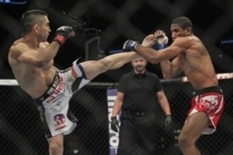 Jun 28, 2014; San Antonio, TX, USA; Ricardo Lamas (red gloves) fights Hacran Dias (blue gloves) in a Featherweight bout at UFC Fight Night 43 at AT&T Center. Mandatory Credit: Troy Taormina-USA TODAY Sports