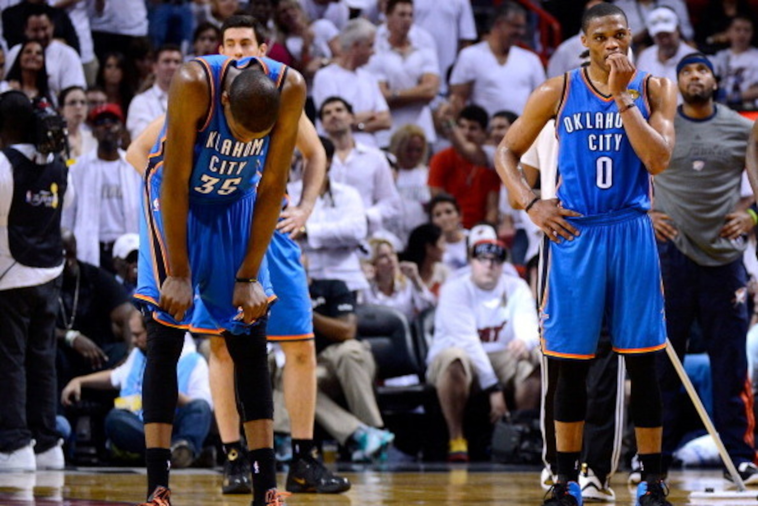MIAMI, FL - JUNE 21:  (L-R) Kevin Durant #35 and Russell Westbrook #0 of the Oklahoma City Thunder stand on court against Miami Heat in Game Five of the 2012 NBA Finals on June 21, 2012 at American Airlines Arena in Miami, Florida. NOTE TO USER: User expr