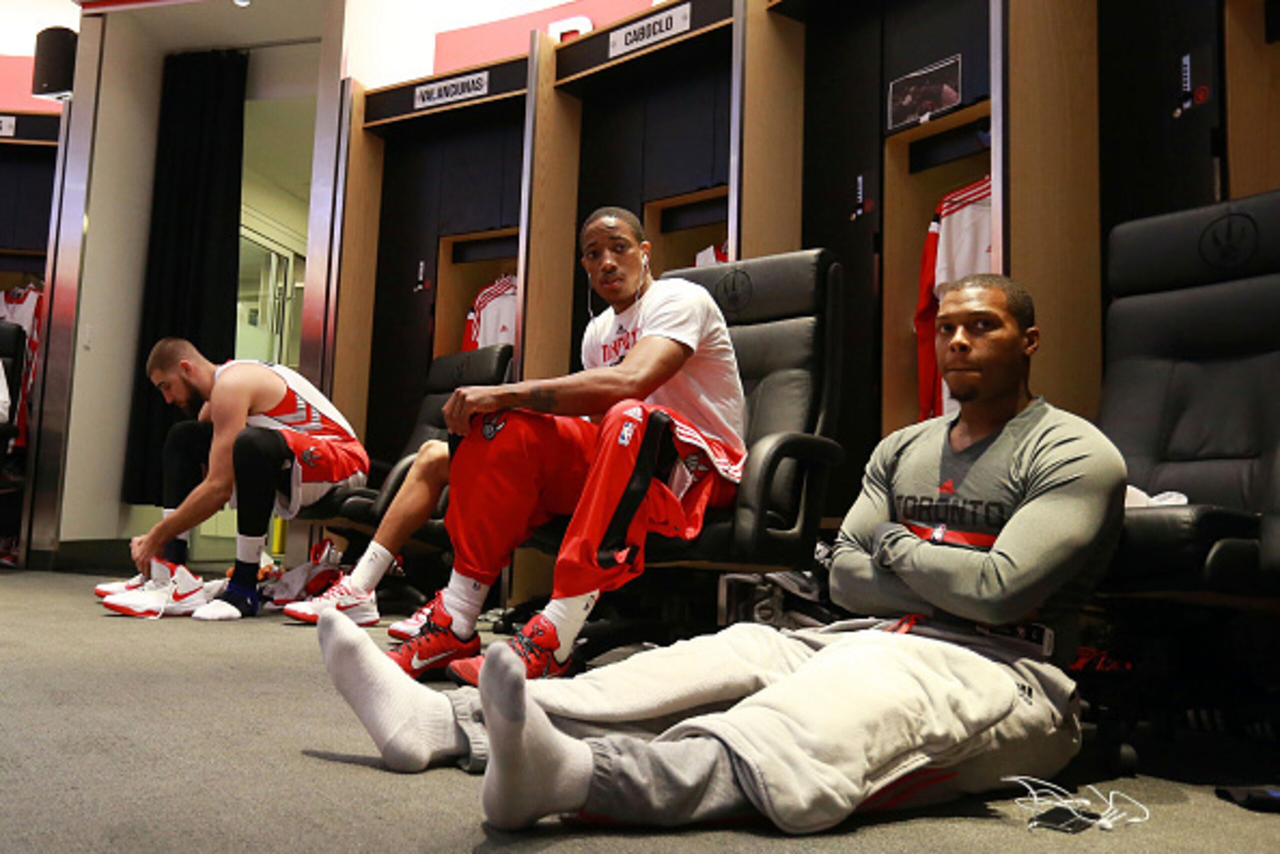TORONTO,ON - OCTOBER 29:  Jonas Valanciunas #17, DeMar DeRozan #10, and Kyle Lowry #7 of the Toronto Raptors prepare to face the Atlanta Hawks during their NBA game at the Air Canada Centre on October 29, 2014 in Toronto, Ontario, Canada. NOTE TO USER: Us