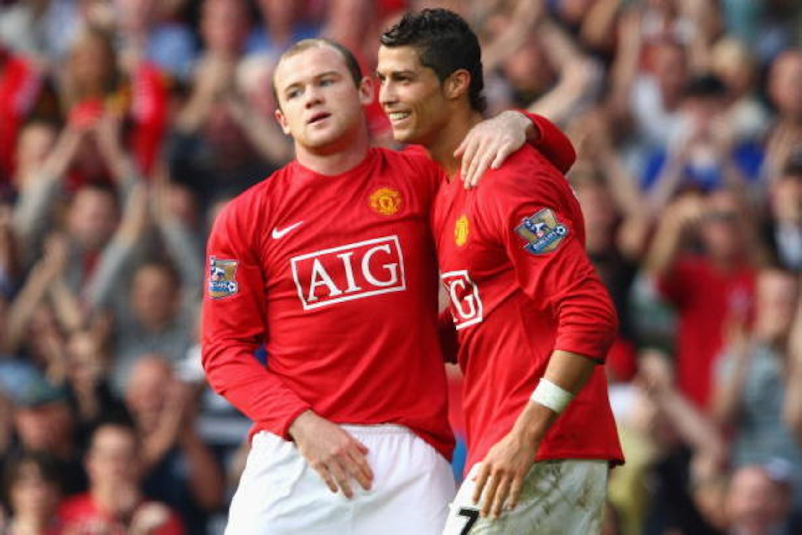 MANCHESTER, UNITED KINGDOM - SEPTEMBER 27: Wayne Rooney of Manchester United celebrates scoring his team's second goal with team mate Cristiano Ronaldo (R) during the Barclays Premier League match between Manchester United and Bolton Wanderers at Old Tra MANCHESTER, UNITED KINGDOM - SEPTEMBER 27: Wayne Rooney of Manchester United celebrates scoring his team's second goal with team mate Cristiano Ronaldo (R) during the Barclays Premier League match between Manchester United and Bolton Wanderers at Old Tra
