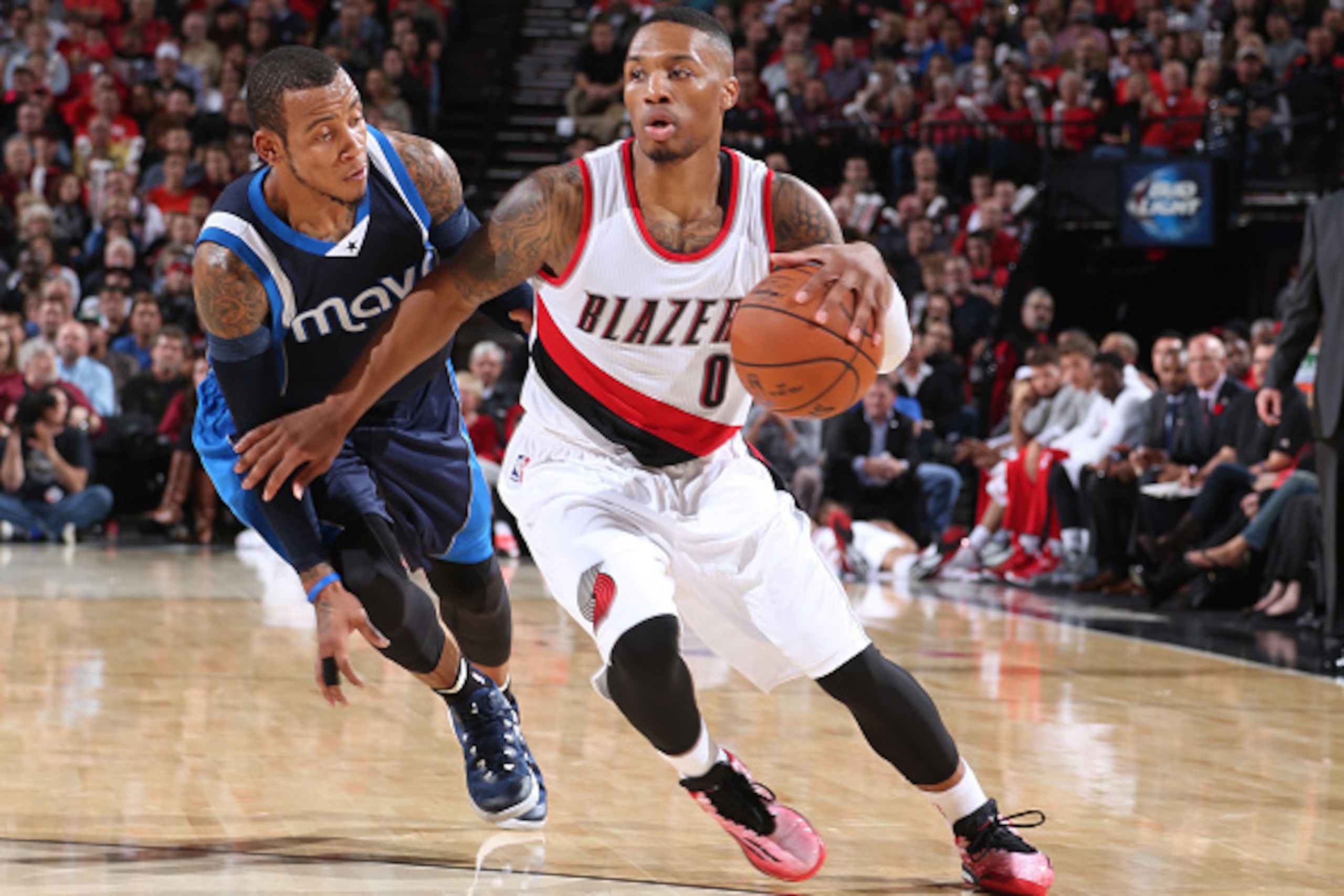 PORTLAND, OR - NOVEMBER 6: Damian Lillard #0 of the Portland Trail Blazers handles the ball against the Dallas Mavericks on November 6, 2014 at the Moda Center Arena in Portland, Oregon. NOTE TO USER: User expressly acknowledges and agrees that, by downlo