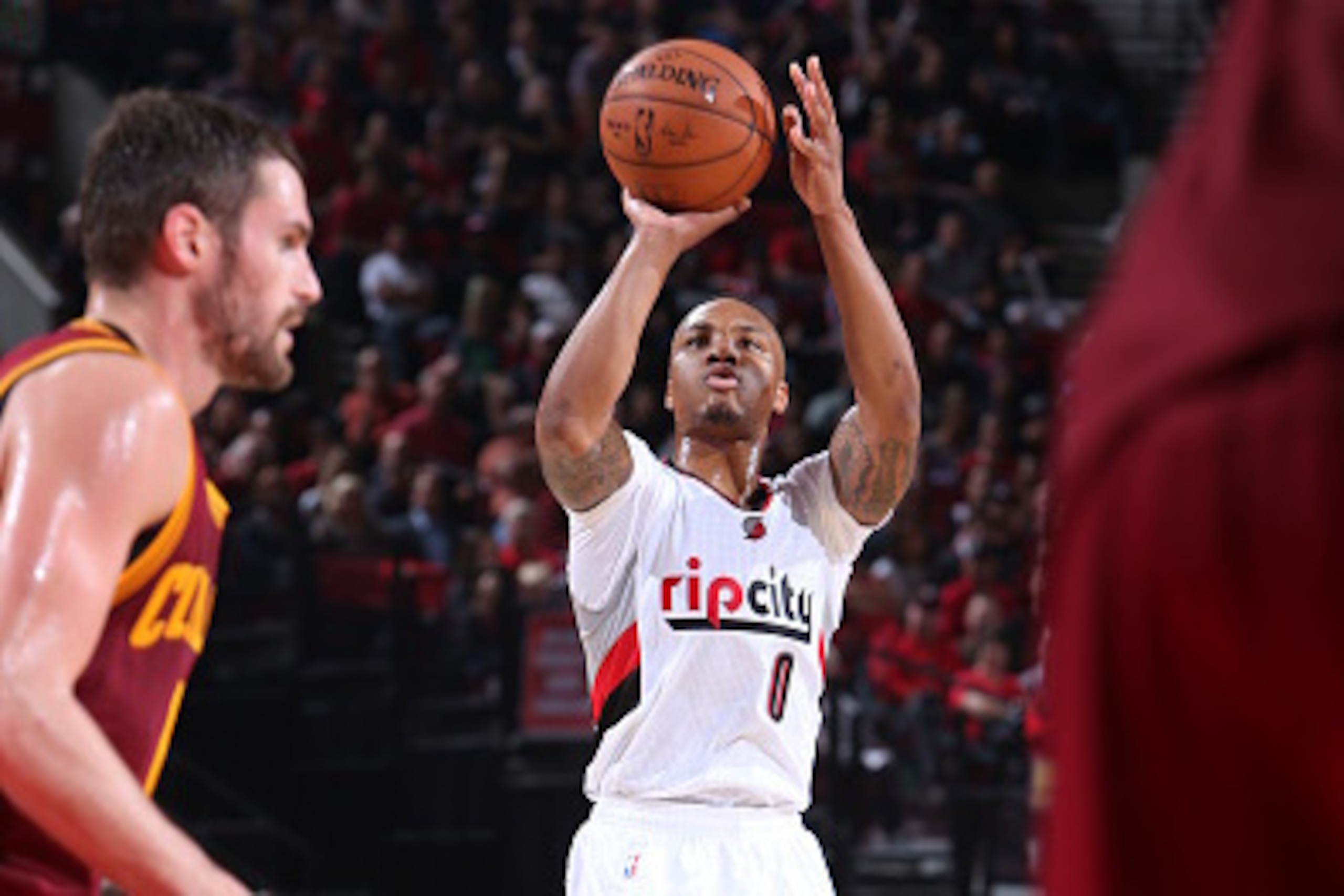 PORTLAND, OR - NOVEMBER 4:  Damian Lillard #0 of the Portland Trail Blazers shoots against the Cleveland Cavaliers on November 4, 2014 at the Moda Center in Portland, Oregon. NOTE TO USER: User expressly acknowledges and agrees that, by downloading and or