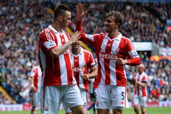 WEST BROMWICH, ENGLAND - MAY 11:  Marko Arnautovic (L) and Marc Muniesa of Stoke City  celebrate an own goal by Gareth McAuley of West Bromwich Albion (not pictured) during the Barclays Premier League match between West Bromwich Albion and Stoke City at T
