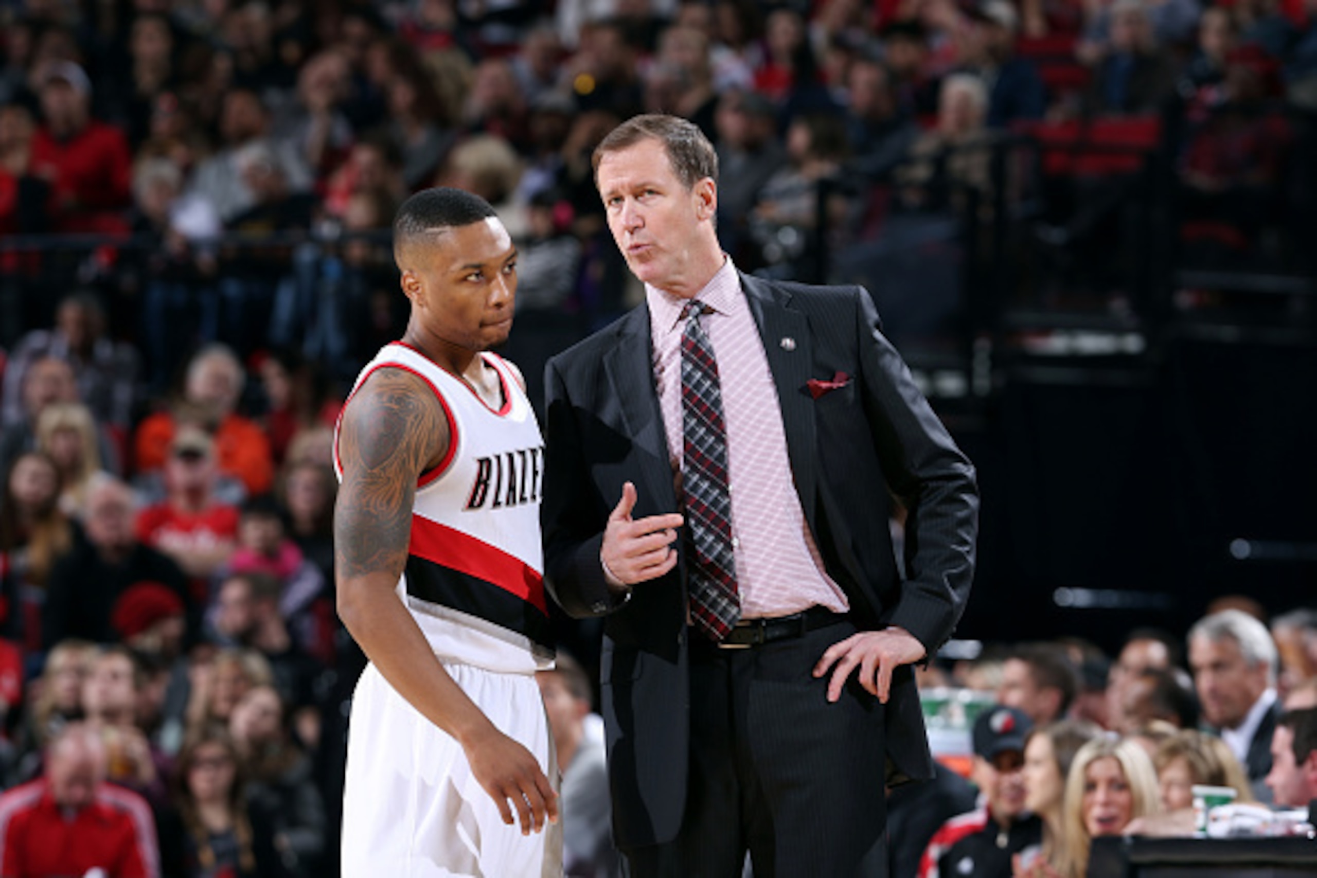 PORTLAND, OR - NOVEMBER 9: Terry Stotts and Damian Lillard #0 of the Portland Trail Blazers speak during a game against the Denver Nuggets on November 9, 2014 at the Moda Center Arena in Portland, Oregon. NOTE TO USER: User expressly acknowledges and agre