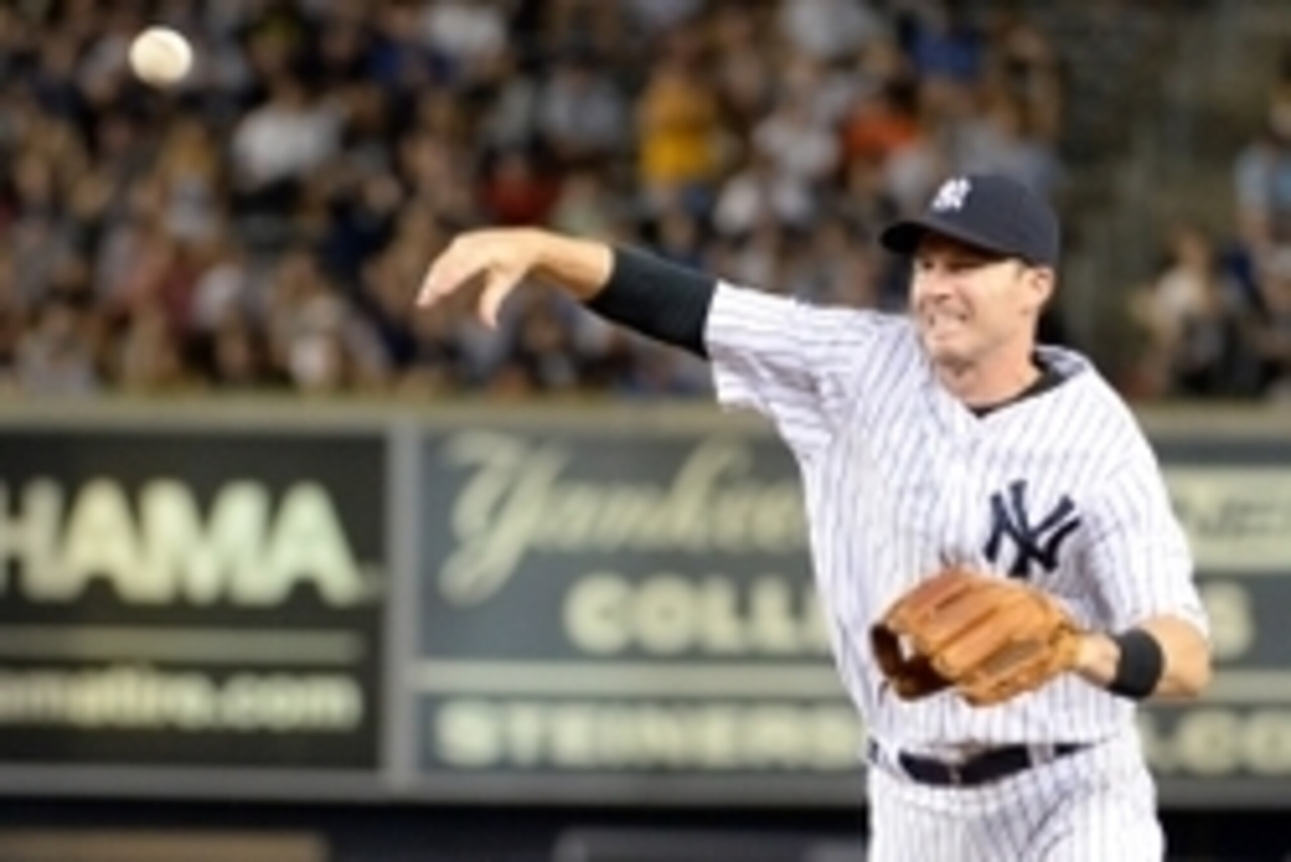 Aug 6, 2014; Bronx, NY, USA; New York Yankees second baseman Stephen Drew (33) throws the ball away in the eighth inning making two errors on one play against the Detroit Tigers at Yankees Stadium. Mandatory Credit: Robert Deutsch-USA TODAY Sports
