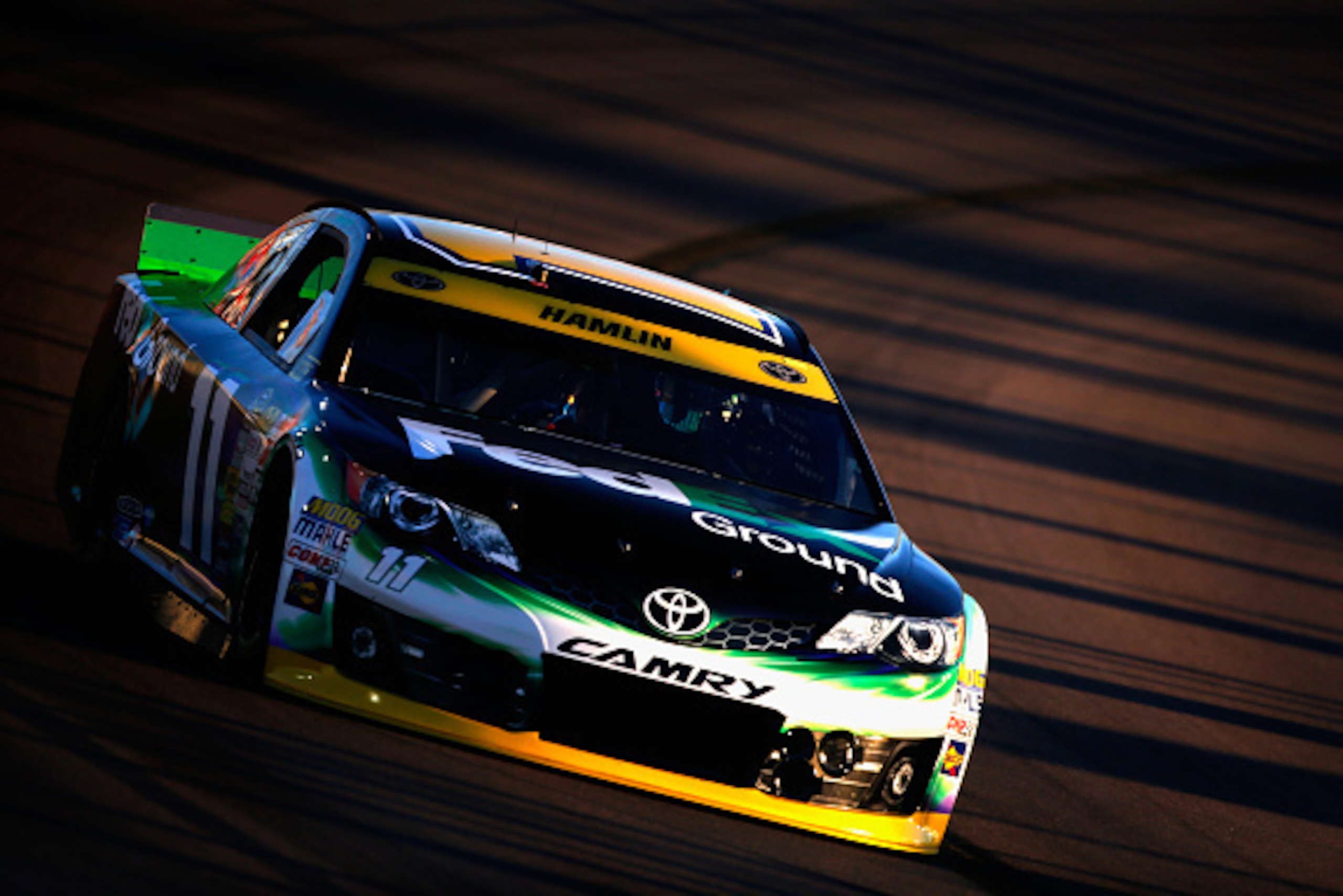 AVONDALE, AZ - NOVEMBER 07:  Denny Hamlin, driver of the #11 FedEx Ground Toyota, qualifies for the NASCAR Sprint Cup Series Quicken Loans Race for Heroes 500 at Phoenix International Raceway on November 7, 2014 in Avondale, Arizona.  (Photo by Jerry Mark