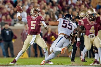 TALLAHASSEE, FL - NOVEMBER 8: Quarterback Jameis Winston #5 of the Florida State Seminoles looks to make a pass against the Virginia Cavaliers during the game at Doak Campbell Stadium on November 8, 2014 in Tallahassee, Florida. The Seminoles beat the Cav