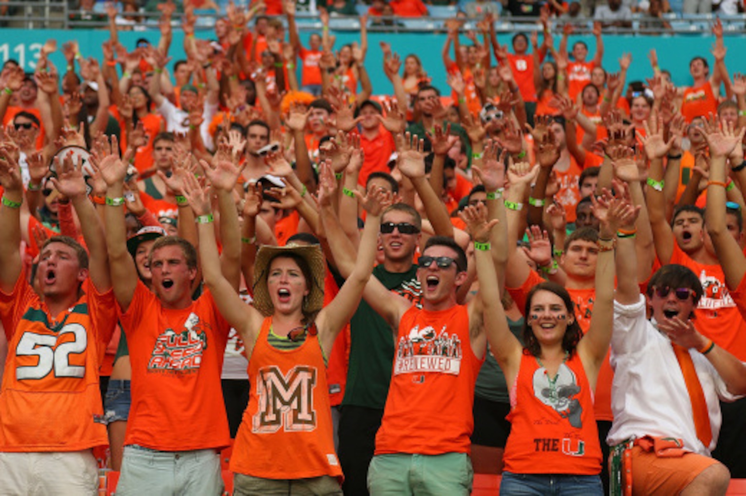MIAMI, FL - SEPTEMBER 13:  Miami Hurricanes fans cheer during a game against the Arkansas State Red Wolves at Sunlife Stadium on September 13, 2014 in Miami, Florida.  (Photo by Mike Ehrmann/Getty Images)