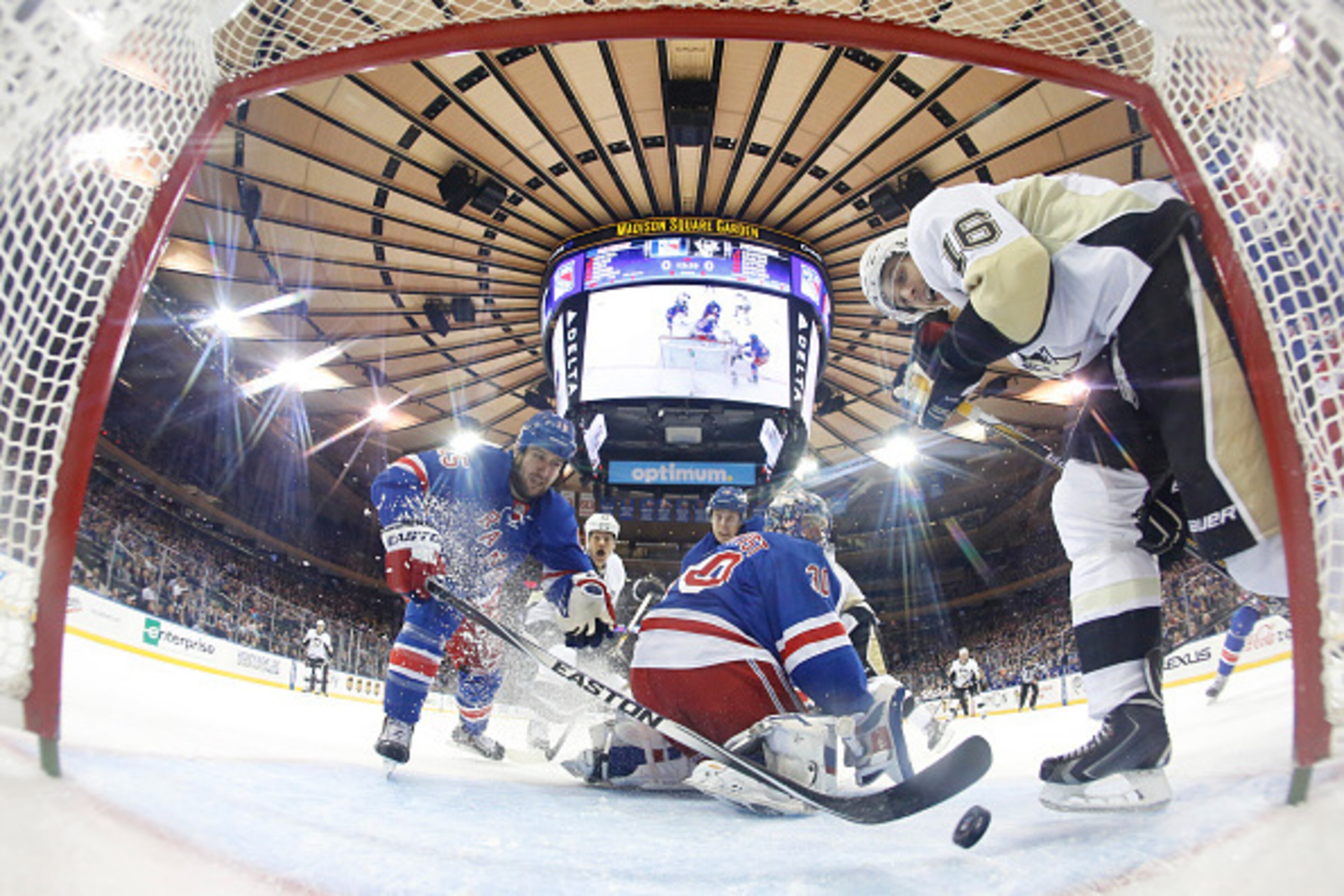 NEW YORK, NY - NOVEMBER 11: Tanner Glass #15 of the New York Rangers clears the puck away from the net against the Pittsburgh Penguins at Madison Square Garden on November 11, 2014 in New York City. (Photo by Jared Silber/NHLI via Getty Images) NEW YORK, NY - NOVEMBER 11: Tanner Glass #15 of the New York Rangers clears the puck away from the net against the Pittsburgh Penguins at Madison Square Garden on November 11, 2014 in New York City. (Photo by Jared Silber/NHLI via Getty Images)