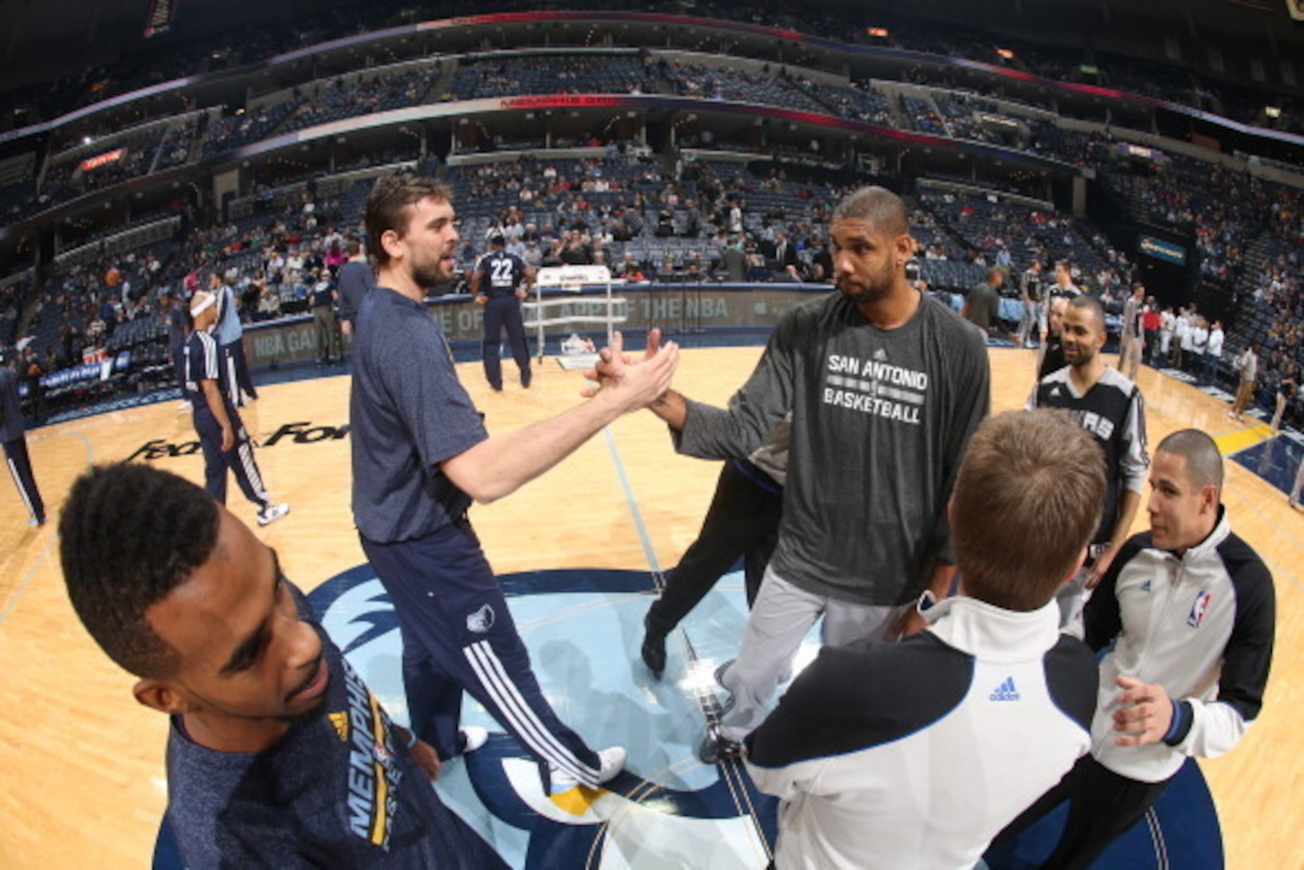 MEMPHIS, TN - NOVEMBER 22: Marc Gasol #33 of the Memphis Grizzlies greets Tim Duncan #21 of the San Antonio Spurs before a game on November 22, 2013 at FedExForum in Memphis, Tennessee. NOTE TO USER: User expressly acknowledges and agrees that, by downloa