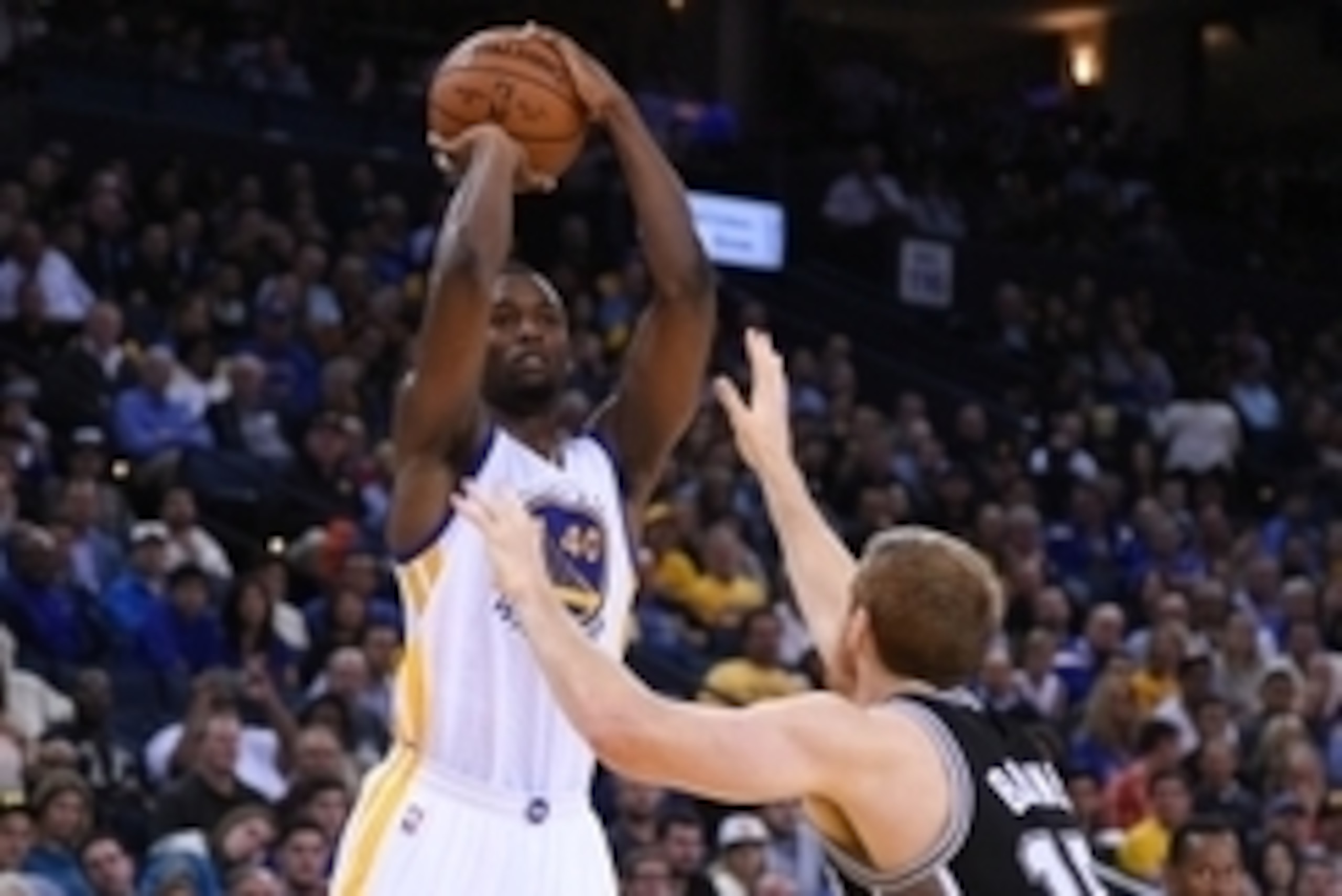 Nov 11, 2014; Oakland, CA, USA; Golden State Warriors forward Harrison Barnes (40) shoots the basketball against San Antonio Spurs forward Matt Bonner (15) during the second quarter at Oracle Arena. Mandatory Credit: Kyle Terada-USA TODAY Sports