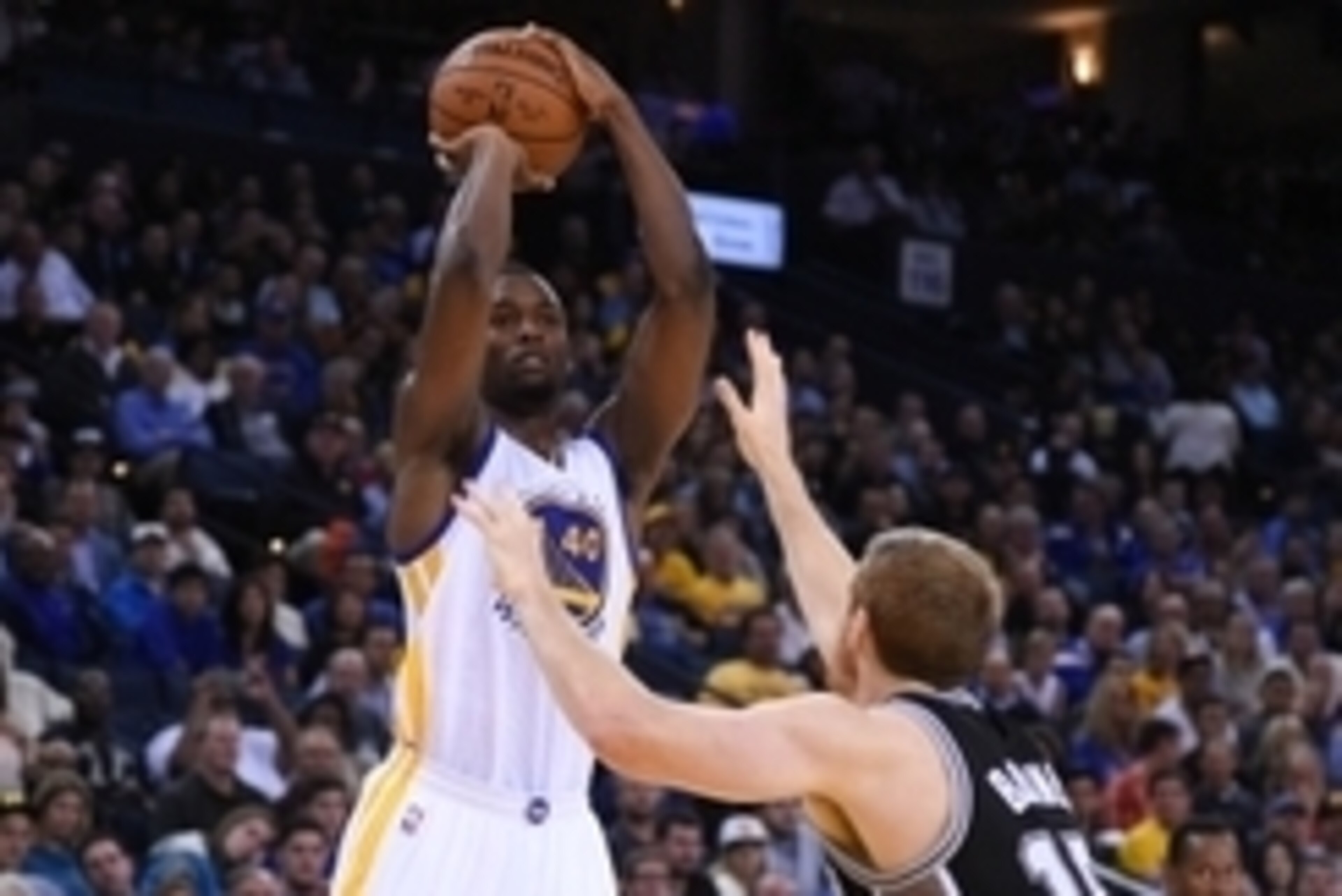 Nov 11, 2014; Oakland, CA, USA; Golden State Warriors forward Harrison Barnes (40) shoots the basketball against San Antonio Spurs forward Matt Bonner (15) during the second quarter at Oracle Arena. Mandatory Credit: Kyle Terada-USA TODAY Sports