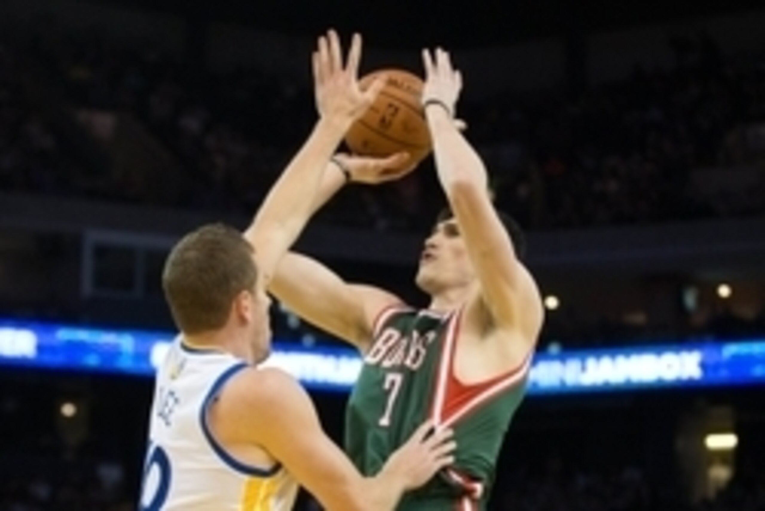 Mar 20, 2014; Oakland, CA, USA; Milwaukee Bucks forward Ersan Ilyasova (7) shoots the ball against Golden State Warriors forward David Lee (10) during the first quarter at Oracle Arena. Mandatory Credit: Kelley L Cox-USA TODAY Sports