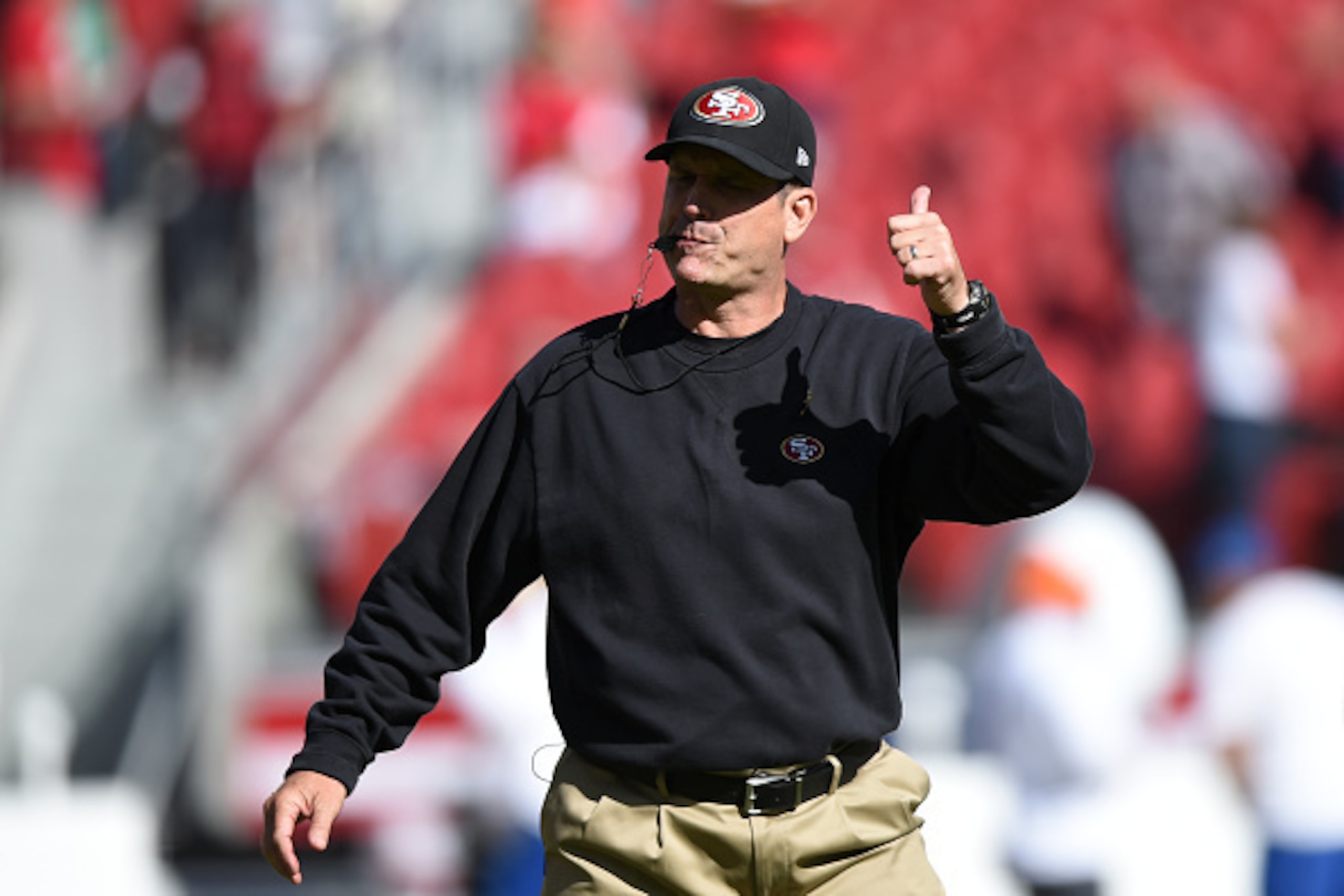 SANTA CLARA, CA - NOVEMBER 02: Head coach Jim Harbaugh of the San Francisco 49ers instructs his team during warm ups before the game at Levi's Stadium on November 2, 2014 in Santa Clara, California.  (Photo by Thearon W. Henderson/Getty Images)