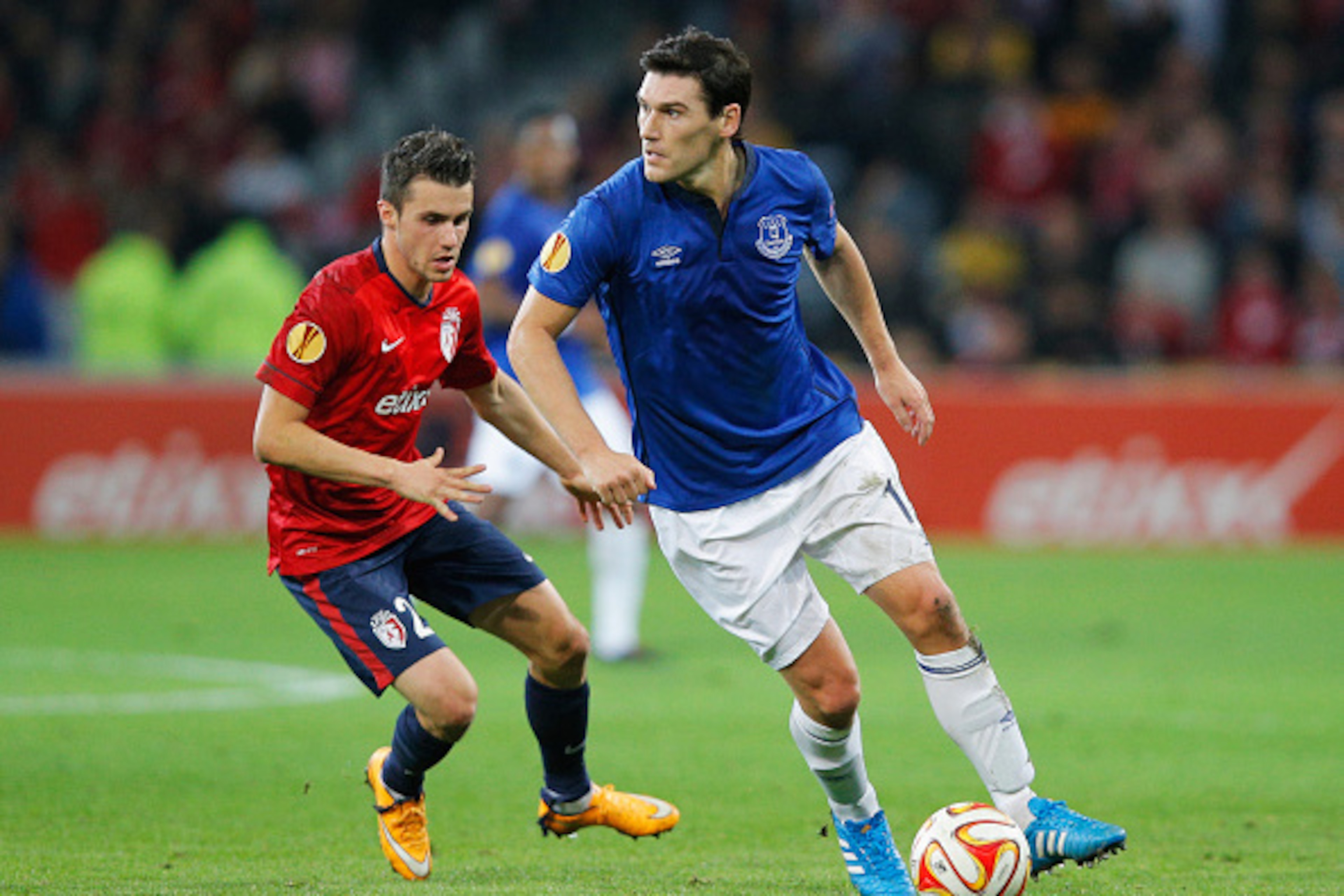 LILLE, FRANCE - OCTOBER 23:  Gareth Barry of Everton is watched by Sebastien Corchia of Lille during the UEFA Europa League Group H match between LOSC Lille and Everton at Grand Stade Lille Metropole on October 23, 2014 in Lille, France.  (Photo by Dean M