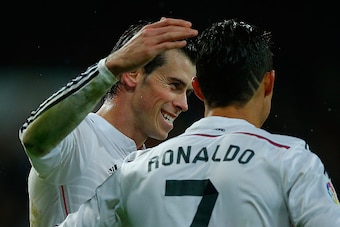 MADRID, SPAIN - NOVEMBER 08:  Cristiano Ronaldo (R) of Real Madrid CF celebrates scoring their fifth goal with teammate Gareth Bale (L) during the La Liga match between Real Madrid CF and Rayo Vallecano de Madrid at Estadio Santiago Bernabeu on November 8