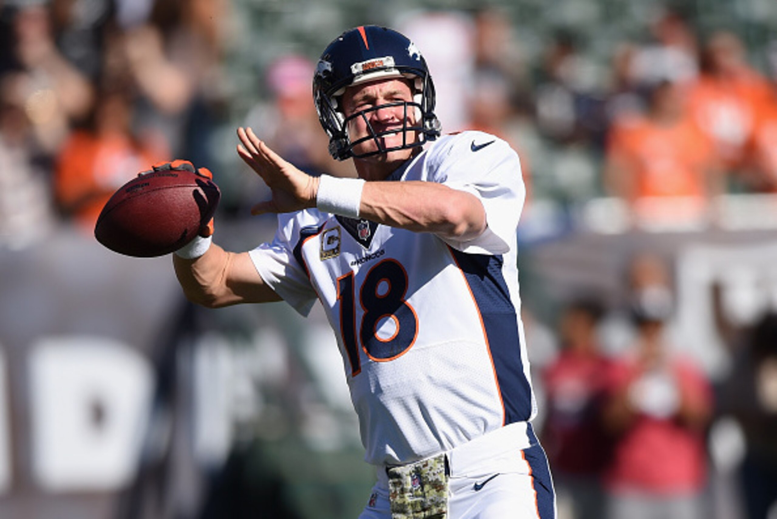 OAKLAND, CA - NOVEMBER 09: Peyton Manning #18 of the Denver Broncos warms up against the Oakland Raiders at O.co Coliseum on November 9, 2014 in Oakland, California. (Photo by Thearon W. Henderson/Getty Images)