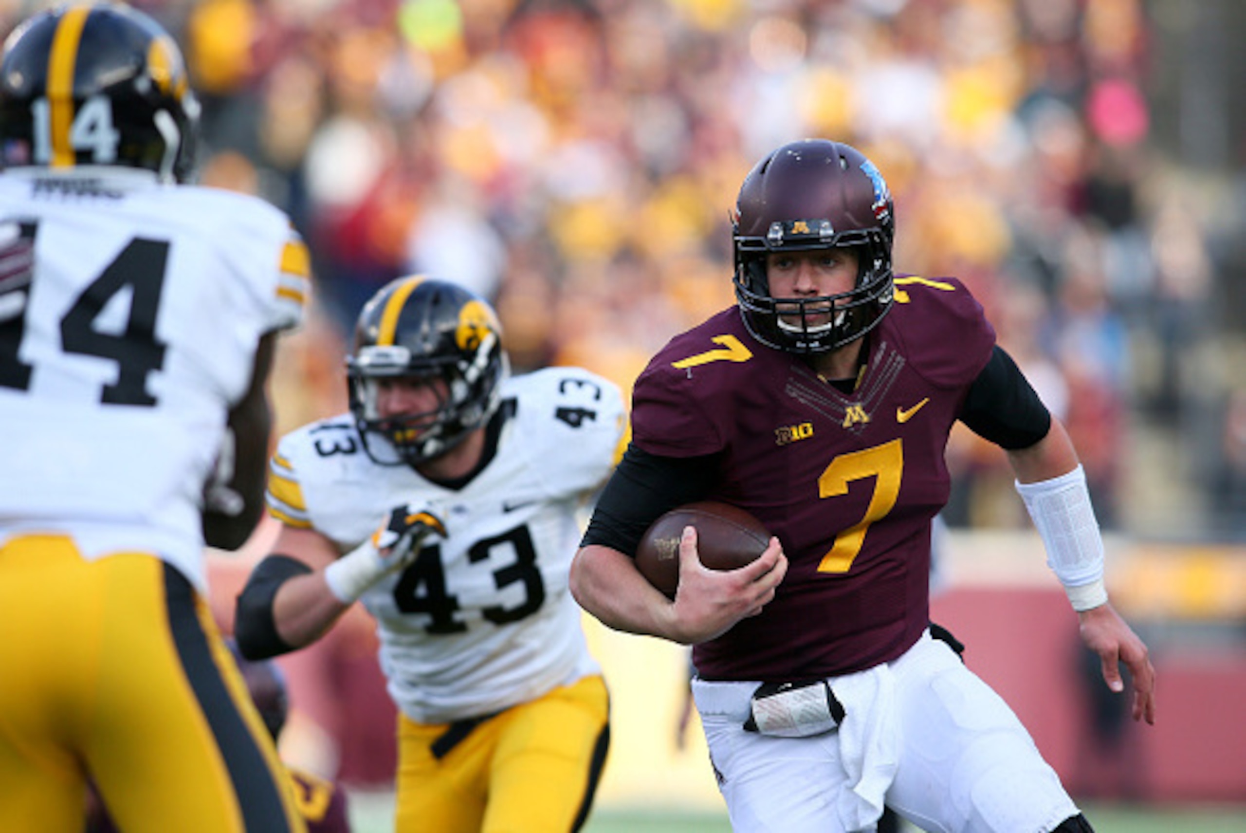 MINNEAPOLIS, MN - NOVEMBER 8: Mitch Leidner #7 of the Minnesota Golden Gophers comes out of the pocket against the Iowa Hawkeyes during the third quarter on November 8, 2014 at TCF Bank Stadium in Minneapolis, Minnesota. (Photo by Adam Bettcher/Getty Ima MINNEAPOLIS, MN - NOVEMBER 8: Mitch Leidner #7 of the Minnesota Golden Gophers comes out of the pocket against the Iowa Hawkeyes during the third quarter on November 8, 2014 at TCF Bank Stadium in Minneapolis, Minnesota. (Photo by Adam Bettcher/Getty Ima