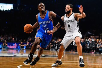 NEW YORK, NY - NOVEMBER 03: Reggie Jackson #15 of the Oklahoma City Thunder attempts to dribble past Deron Williams #8 of the Brooklyn Nets at the Barclays Center on November 3, 2014 in the Brooklyn borough of New York City. NOTE TO USER: User expressly a