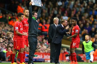 LIVERPOOL, ENGLAND - OCTOBER 25:  Brendan Rodgers the manager of Liverpool talks with Raheem Sterling during the Barclays Premier League match between Liverpool and Hull City at Anfield on October 25, 2014 in Liverpool, England.  (Photo by Alex Livesey/Ge