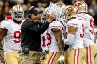 Nov 9, 2014; New Orleans, LA, USA; San Francisco 49ers head coach Jim Harbaugh (C) celebrates with cornerback Chris Culliver (29) after an interception against the New Orleans Saints during the second quarter at Mercedes-Benz Superdome. Mandatory Credit: 