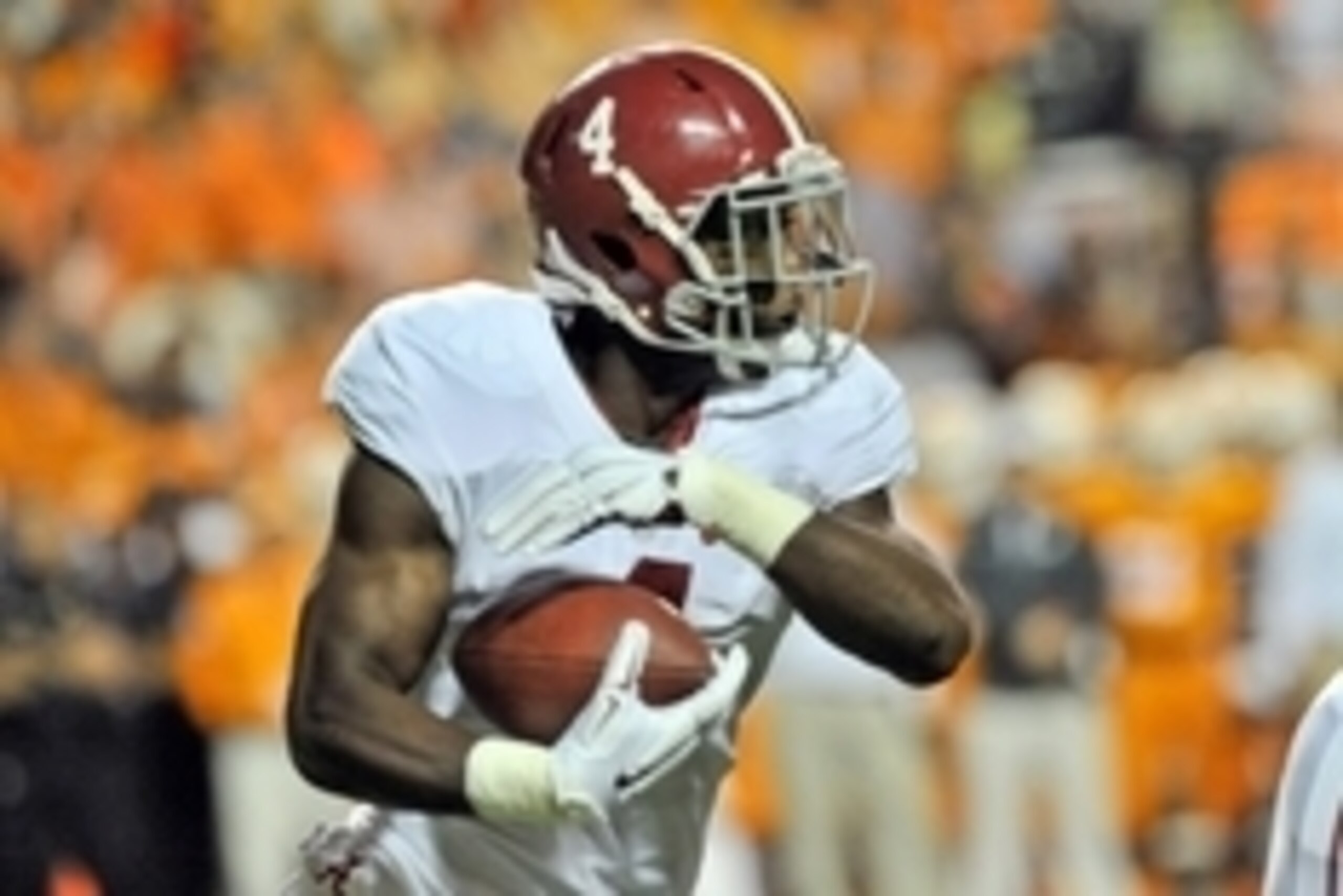 Oct 25, 2014; Knoxville, TN, USA; Alabama Crimson Tide running back T.J. Yeldon (4) rushes against the Tennessee Volunteers during the first half game at Neyland Stadium. Mandatory Credit: Jim Brown-USA TODAY Sports
