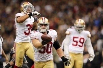 Nov 9, 2014; New Orleans, LA, USA; San Francisco 49ers inside linebacker Chris Borland (50) celebrates after a fumble by New Orleans Saints quarterback Drew Brees (not pictured) in overtime at Mercedes-Benz Superdome. The 49ers won 27-24. Mandatory Credit