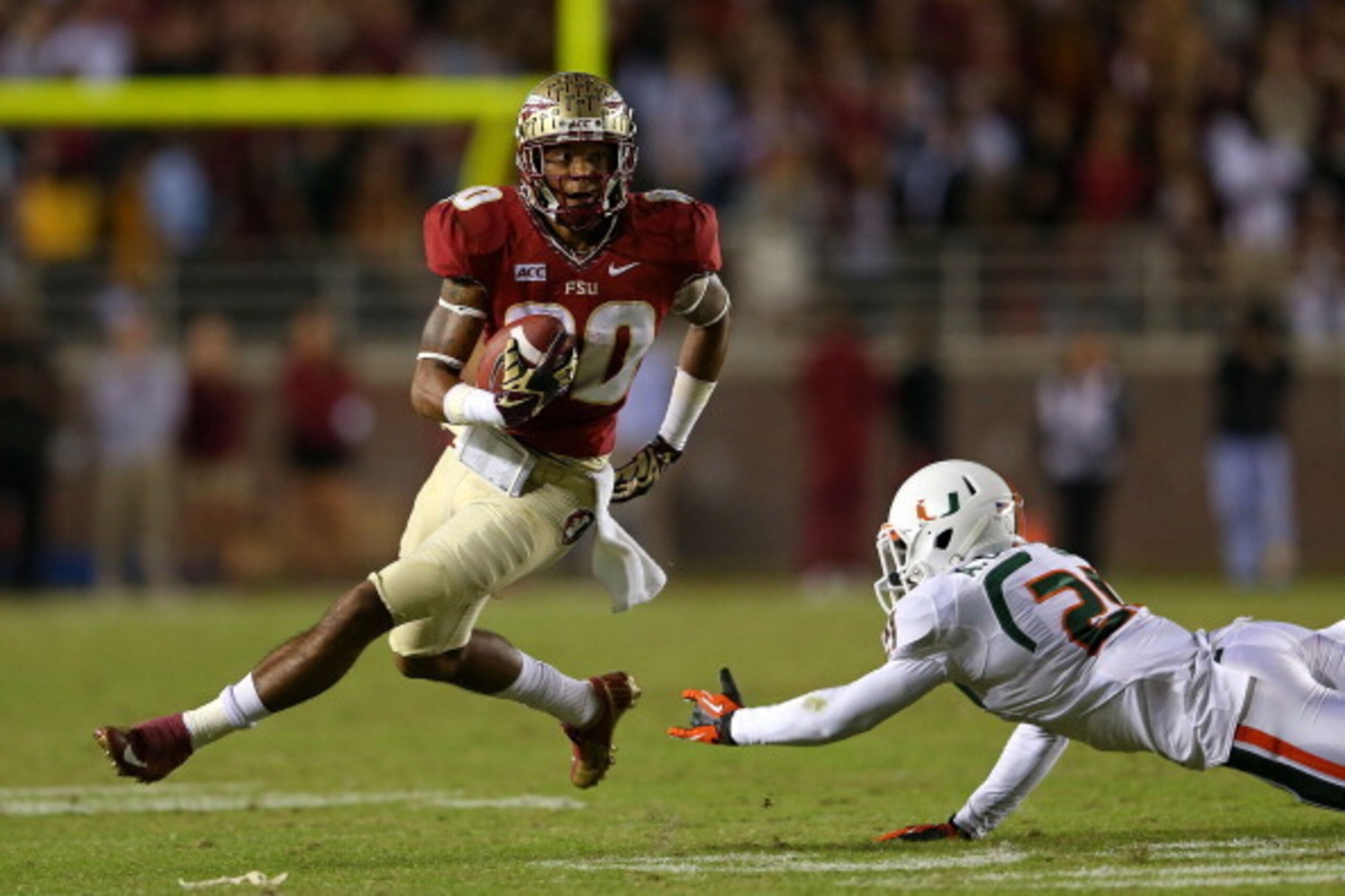 TALLAHASSEE, FL - NOVEMBER 02: Rashad Greene #80 of the Florida State Seminoles runs after a catch during a game against the Miami Hurricanes at Doak Campbell Stadium on November 2, 2013 in Tallahassee, Florida.  (Photo by Mike Ehrmann/Getty Images)