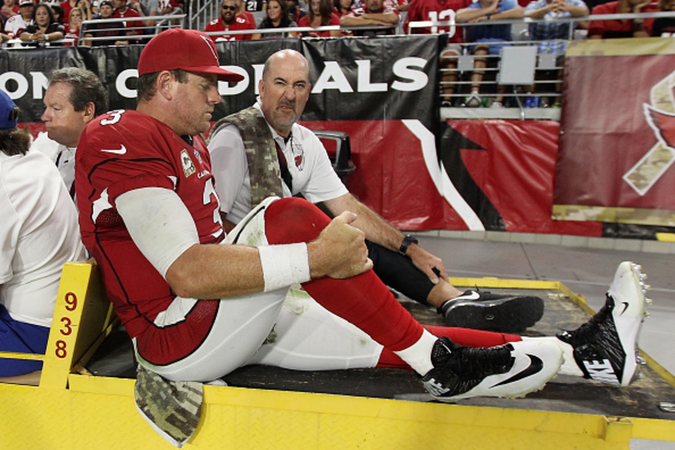GLENDALE, AZ - NOVEMBER 09:  Quarterback Carson Palmer #3 of the Arizona Cardinals is taken off the field on a cart after being injured on the field in the fourth quarter of the NFL game against the St. Louis Rams at University of Phoenix Stadium on Novem