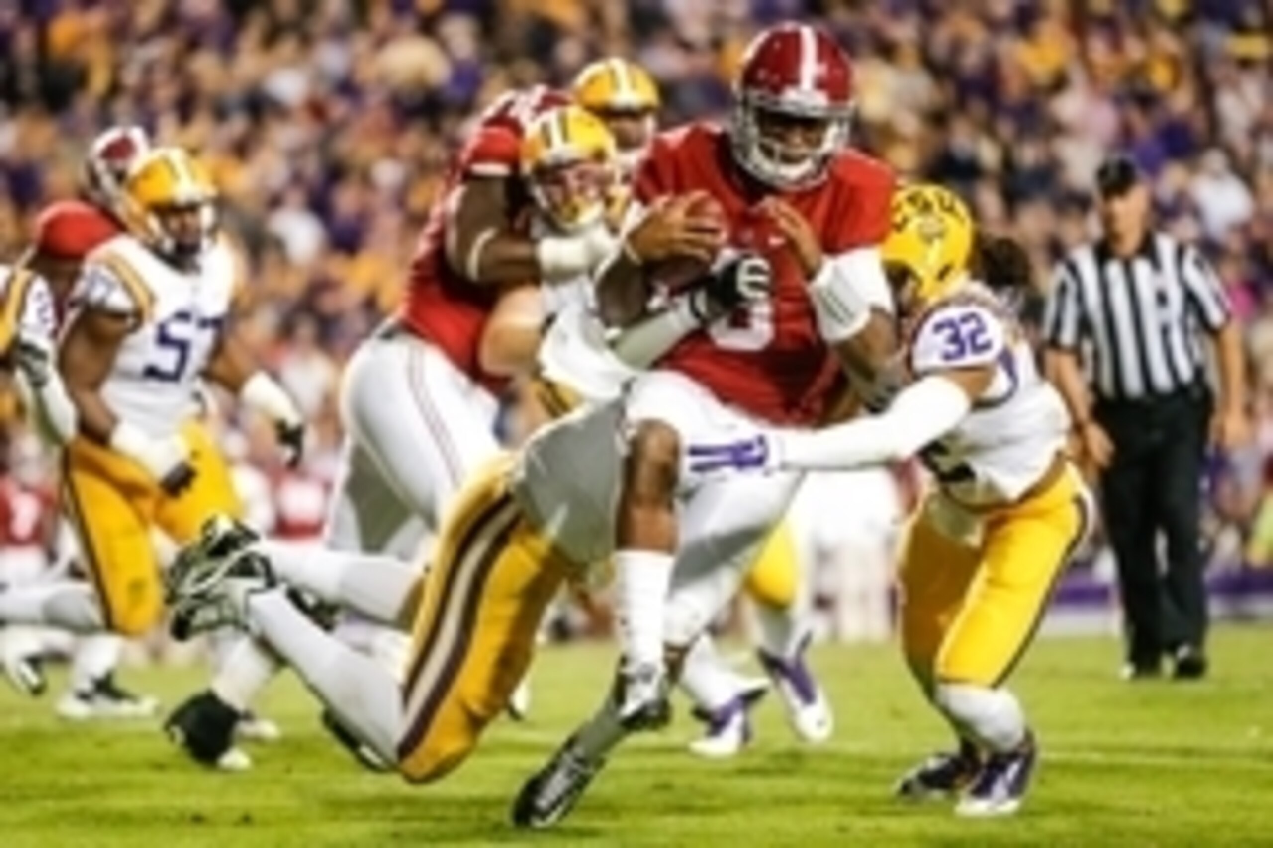 Nov 8, 2014; Baton Rouge, LA, USA; Alabama Crimson Tide quarterback Blake Sims (6) is tackled by LSU Tigers defensive end Jermauria Rasco (59) during the fourth quarter of a game at Tiger Stadium. Alabama defeated LSU 20-13. Mandatory Credit: Derick E. Hi
