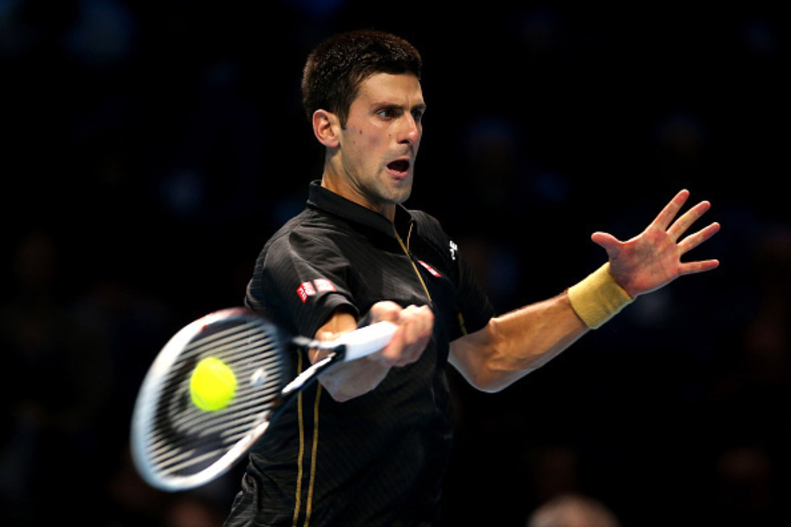 LONDON, ENGLAND - NOVEMBER 12: Novak Djokovic of Serbia plays a forehand in the round robin singles match against Stan Wawrinka of Switzerland on day four of the Barclays ATP World Tour Finals at the O2 Arena on November 12, 2014 in London, England. (Ph LONDON, ENGLAND - NOVEMBER 12: Novak Djokovic of Serbia plays a forehand in the round robin singles match against Stan Wawrinka of Switzerland on day four of the Barclays ATP World Tour Finals at the O2 Arena on November 12, 2014 in London, England. (Ph