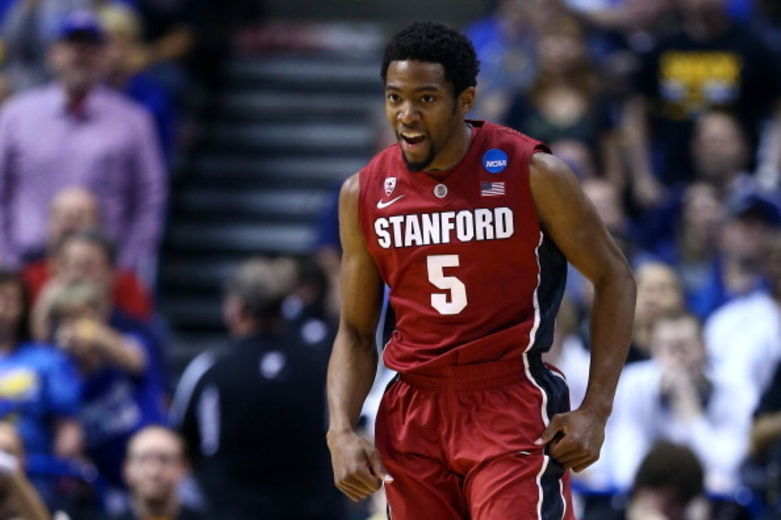 ST LOUIS, MO - MARCH 23:  Chasson Randle #5 of the Stanford Cardinal celebrates after a basket in the second half against the Kansas Jayhawks during the third round of the 2014 NCAA Men's Basketball Tournament at Scottrade Center on March 23, 2014 in St L