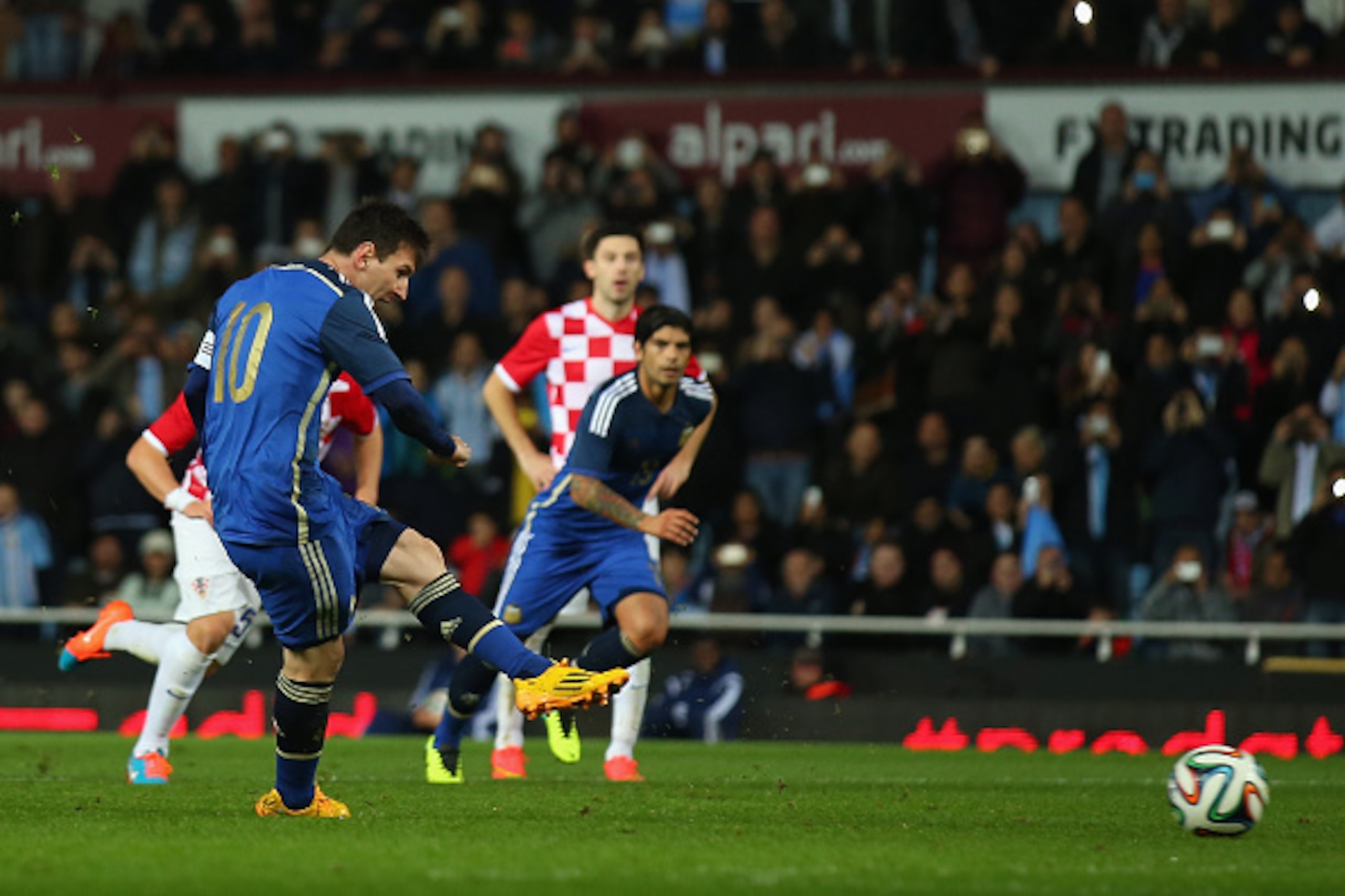 LONDON, ENGLAND - NOVEMBER 12:  Lionel Messi of Argentina scores form a penalty during the International Friendly between Argentina and Croatia at Boleyn Ground on November 12, 2014 in London, England.  (Photo by Bryn Lennon/Getty Images)