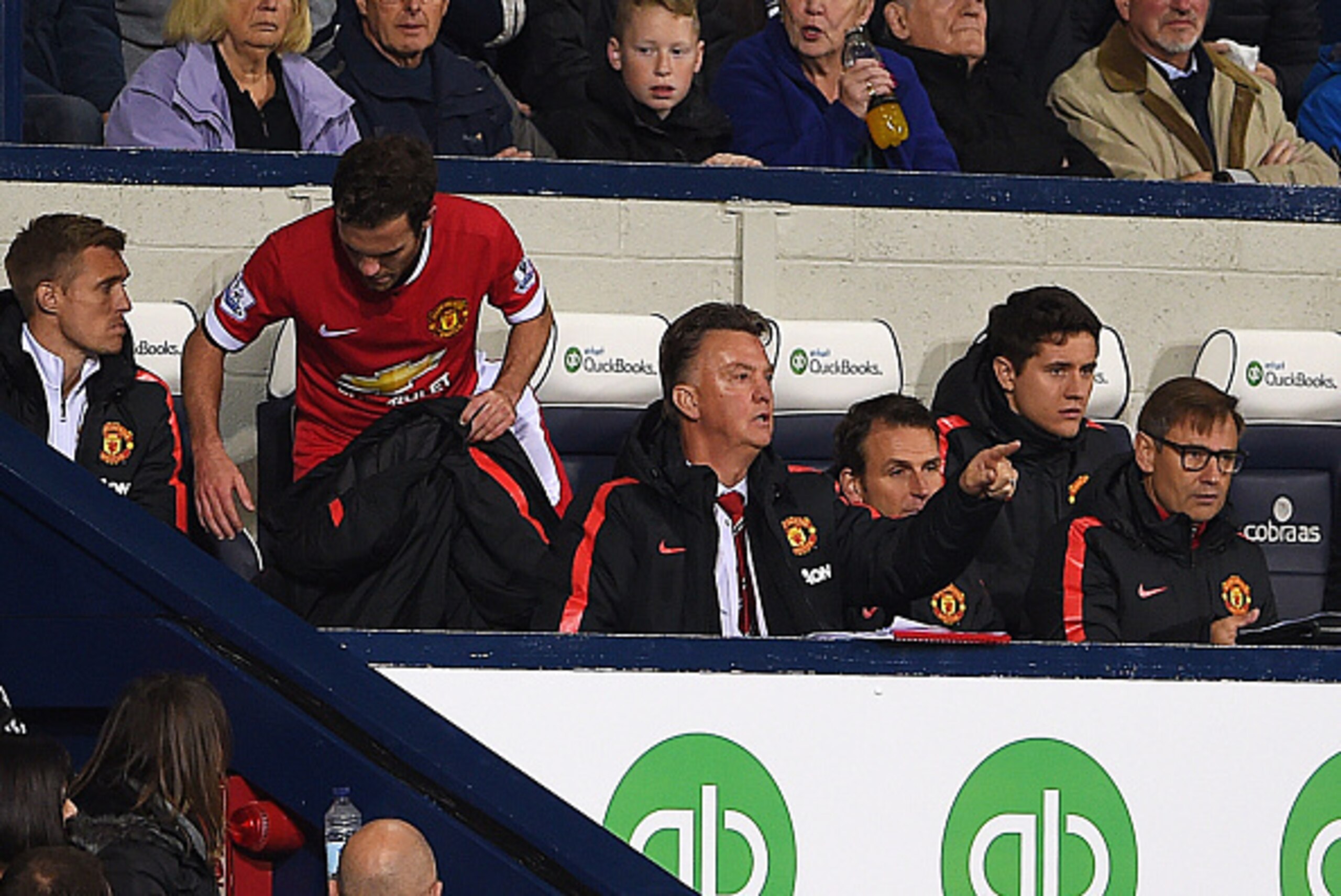 WEST BROMWICH, ENGLAND - OCTOBER 20:  Louis van Gaal manager of Manchester United signals from the bench as he susbstitutes Juan Mata (2L) during the Barclays Premier League match between West Bromwich Albion and Manchester United at The Hawthorns on Octo