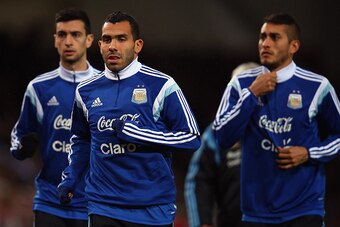 LONDON, ENGLAND - NOVEMBER 12:  Carlos Tevez of Argentina warms up prior to playing in the second half of the International Friendly between Argentina and Croatia at Boleyn Ground on November 12, 2014 in London, England.  (Photo by Bryn Lennon/Getty Image