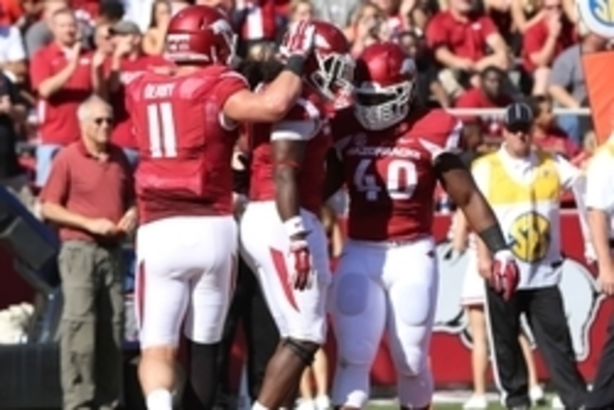 Oct 25, 2014; Fayetteville, AR, USA; Arkansas Razorbacks tight end AJ Derby (11) and fullback Patrick Arinze (40) congratulate running back Alex Collins (3) after a rushing touchdown by Collins in the first quarter against the UAB Blazers at Donald W. Rey